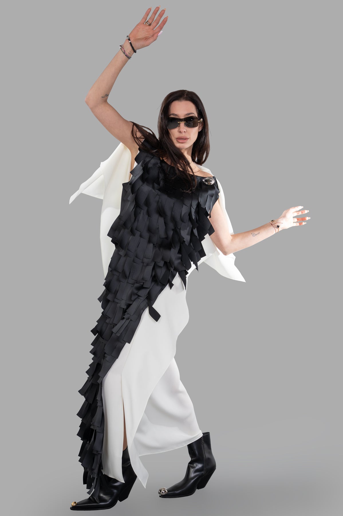 A.W.A.K.E. MODE Laser-cut Satin & Twill Gown, front view on model, shows black geometric overlay and white draped panel.