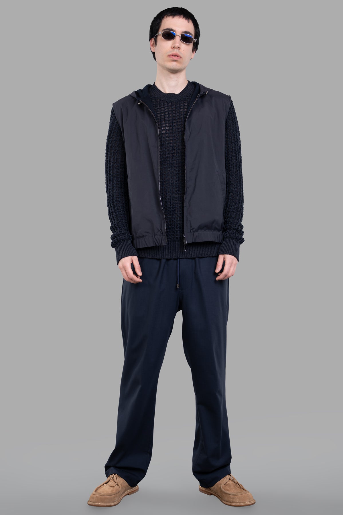 AION Hooded Vest Jacket in navy, on-model front view, perfect for brisk walks, made from polyester and cotton.