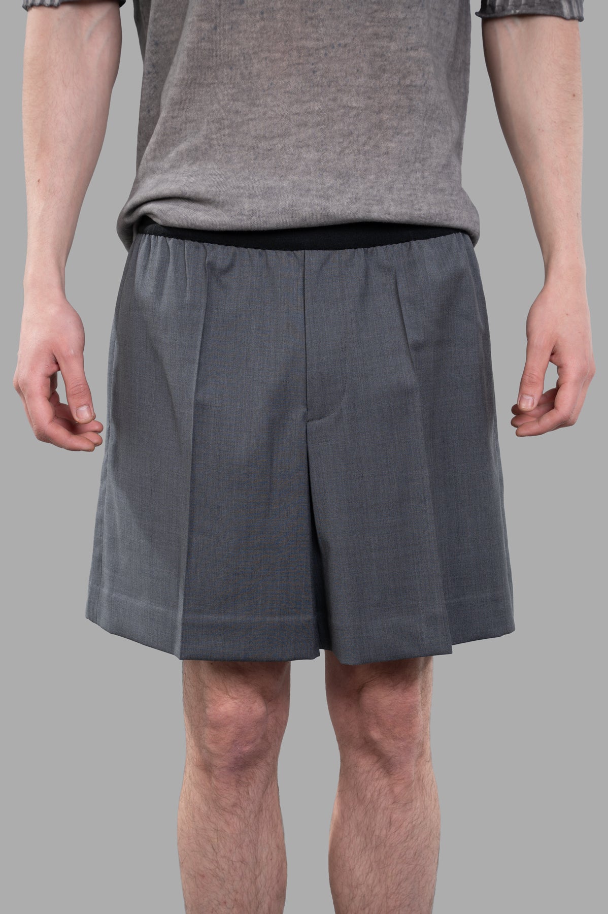 Helmut Lang Pull-On Car Shorts in grey satin logo jacquard, featuring a tailored fit and hidden side pockets on model.