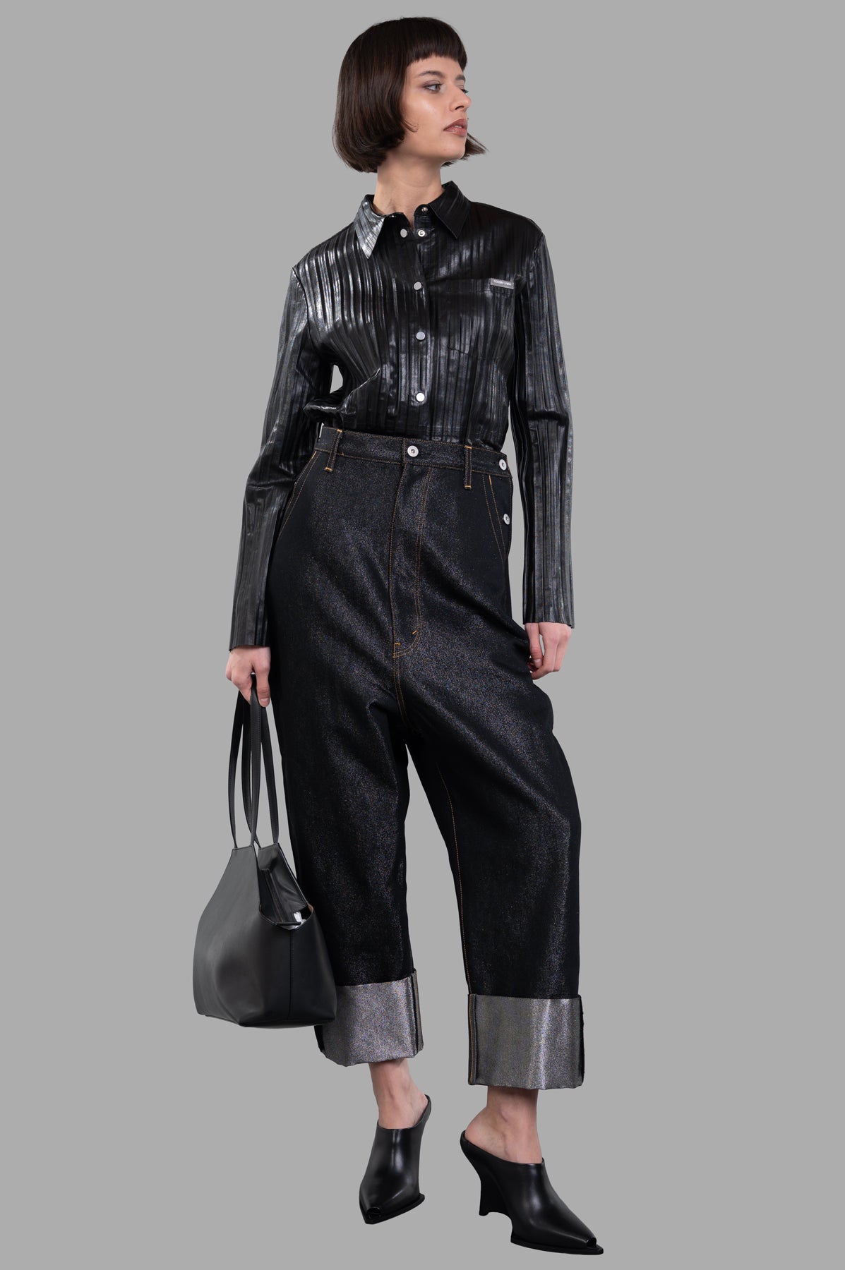 Helmut Lang Pleated Leather Shirt in black, button-front, shown from front on model with matching trousers.
