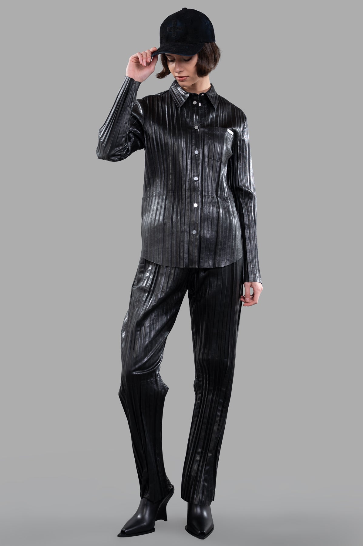 Helmut Lang Pleated Leather Car Trousers in black, full front view on a model, relaxed fit with straight leg.