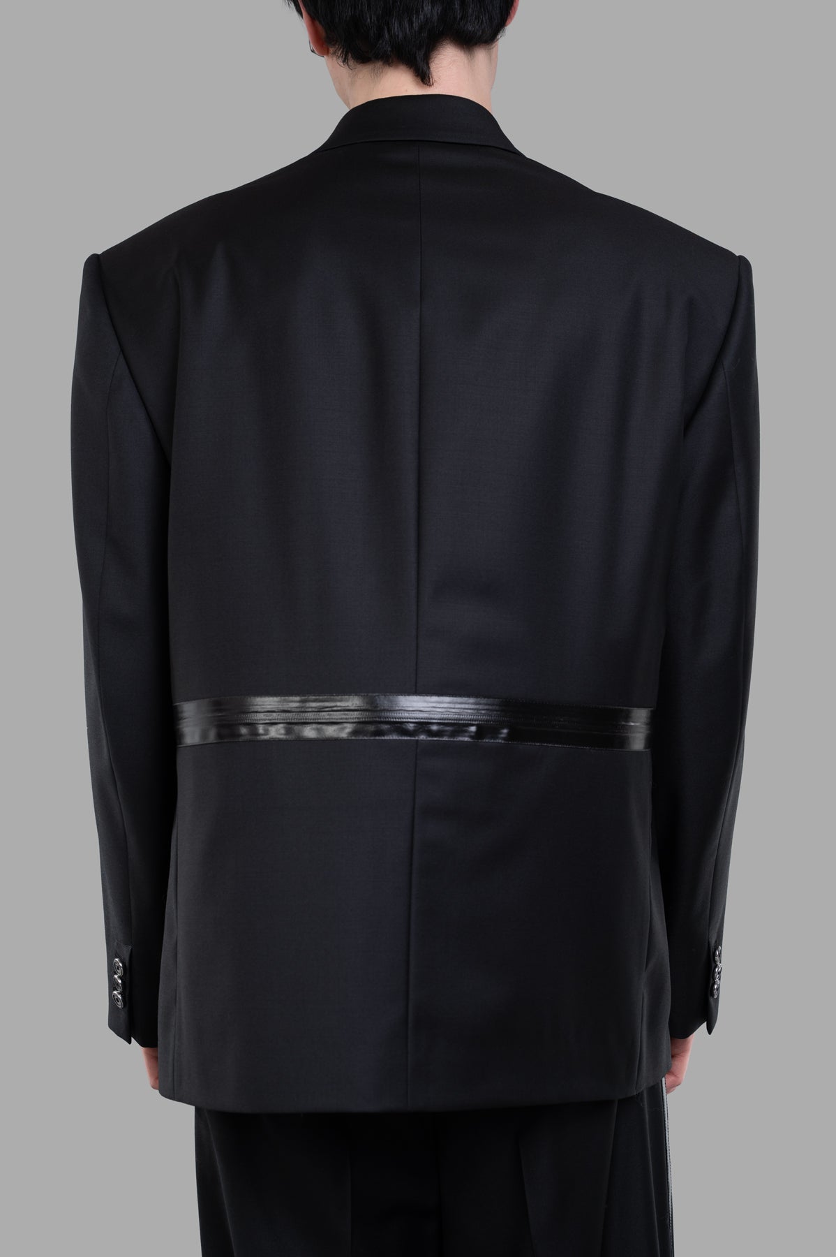 Helmut Lang Zip Driver Blazer, black wool twill, showing oversized back with tonal aquaseal zipper detail.