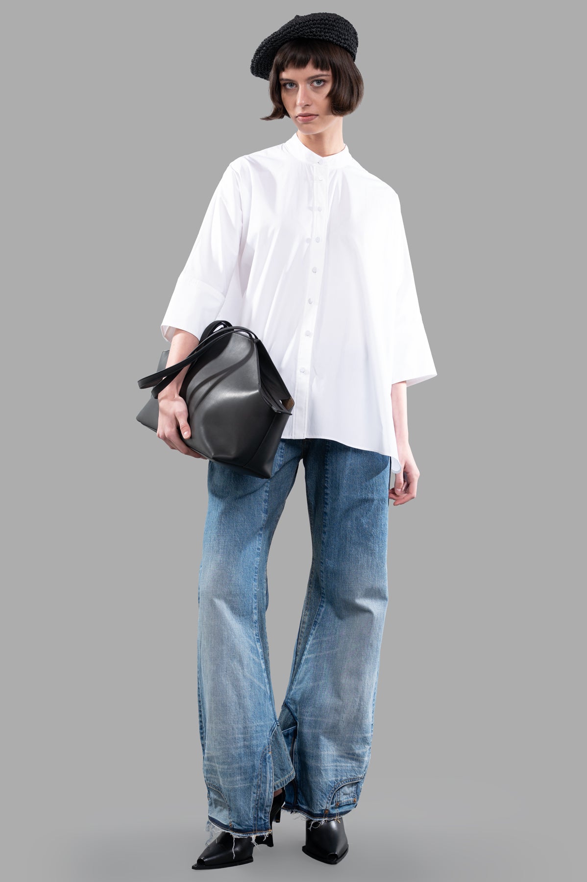 Joseph Oversized Poplin Shirt, white, front view on model, paired with jeans and a black bag, casual chic style.