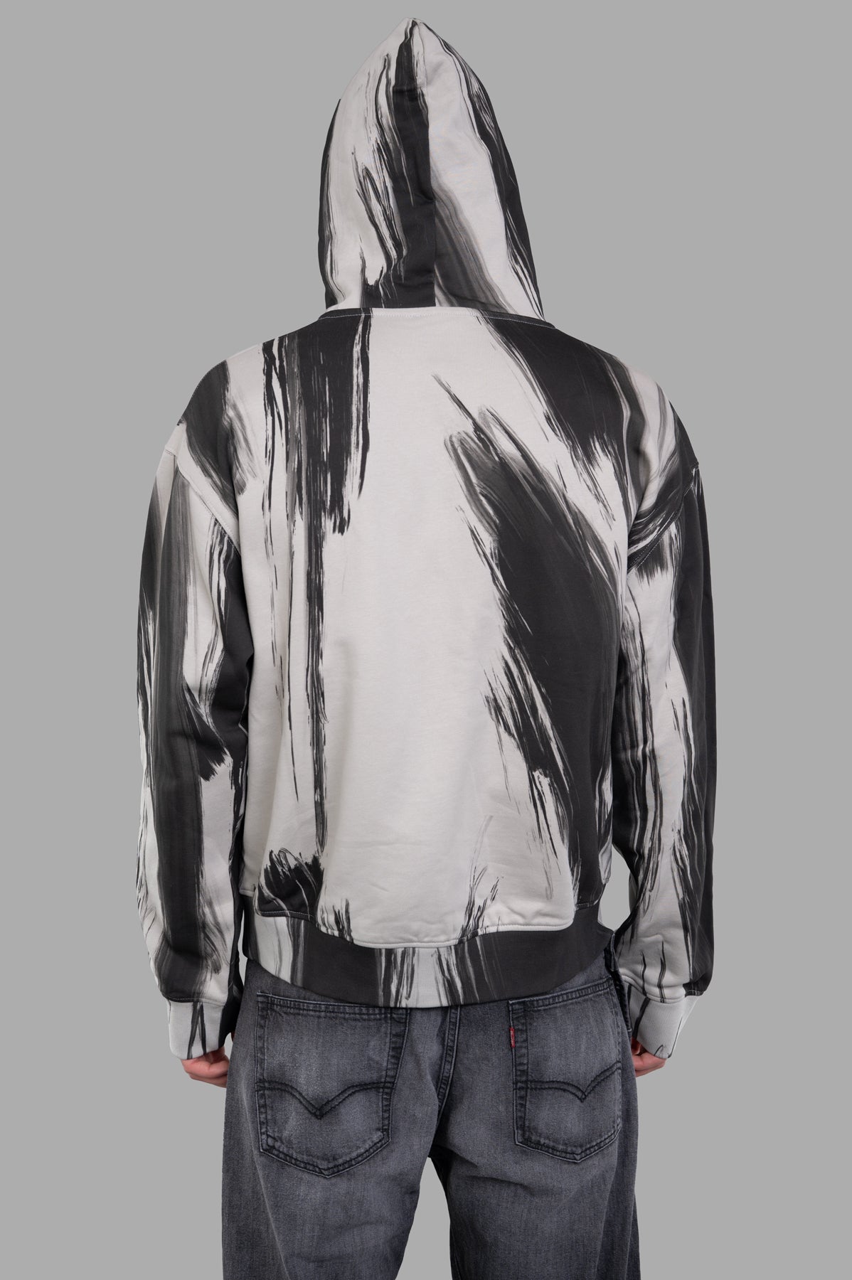 Helmut Lang Feather Studio Hoodie in grey, oversized design with exclusive brushstroke pattern, shown from the back.