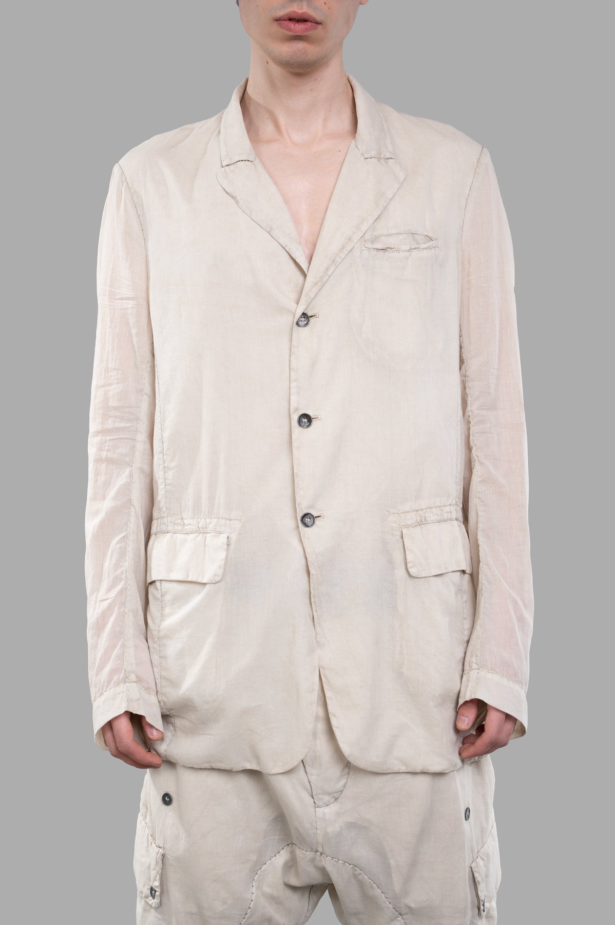 Masnada Single-breasted Lightweight Blazer in ecru featuring a collarless design and front flap pockets, modeled front view.