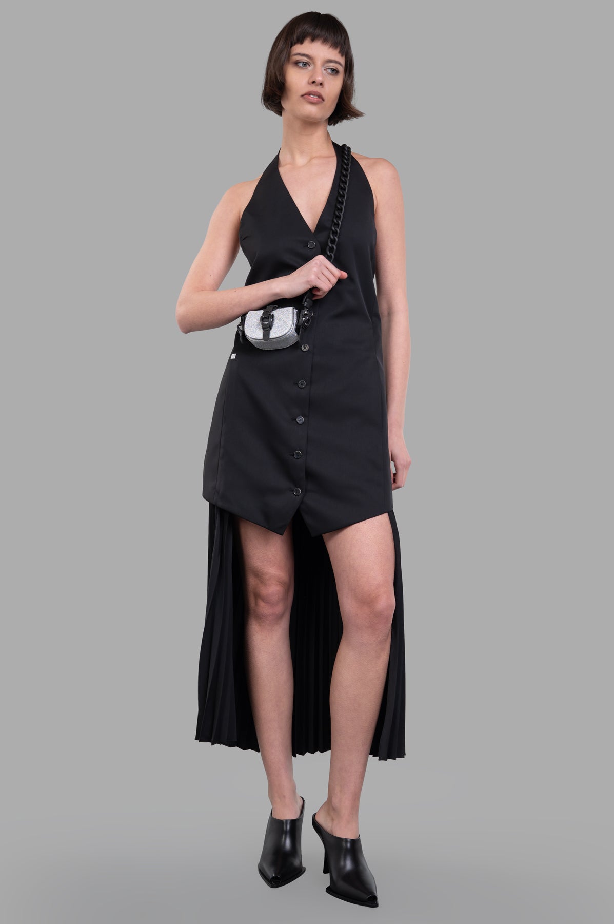 Helmut Lang Halter Vest Dress in black, front view, with pleated skirt detail and button closure, on-model.