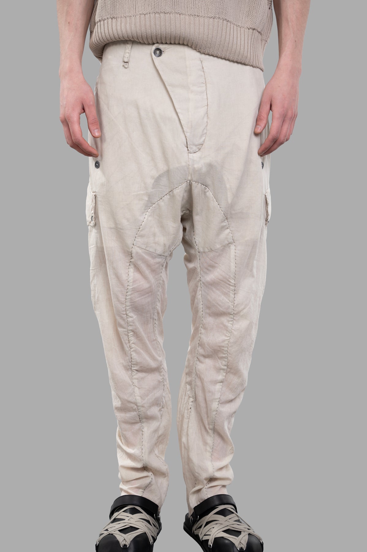 Masnada Lightweight Drop-crotch Pants in ecru, featuring drawstring waist and cargo pocket details, showcased on model.