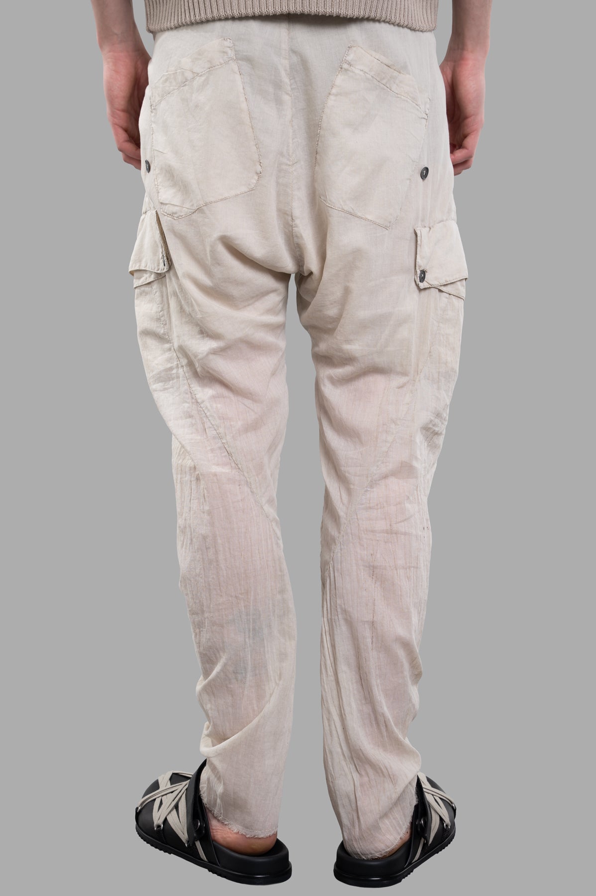 Masnada Lightweight Drop-crotch Pants in ecru, showing back view with elastic waistband and cargo pockets. 100% cotton.
