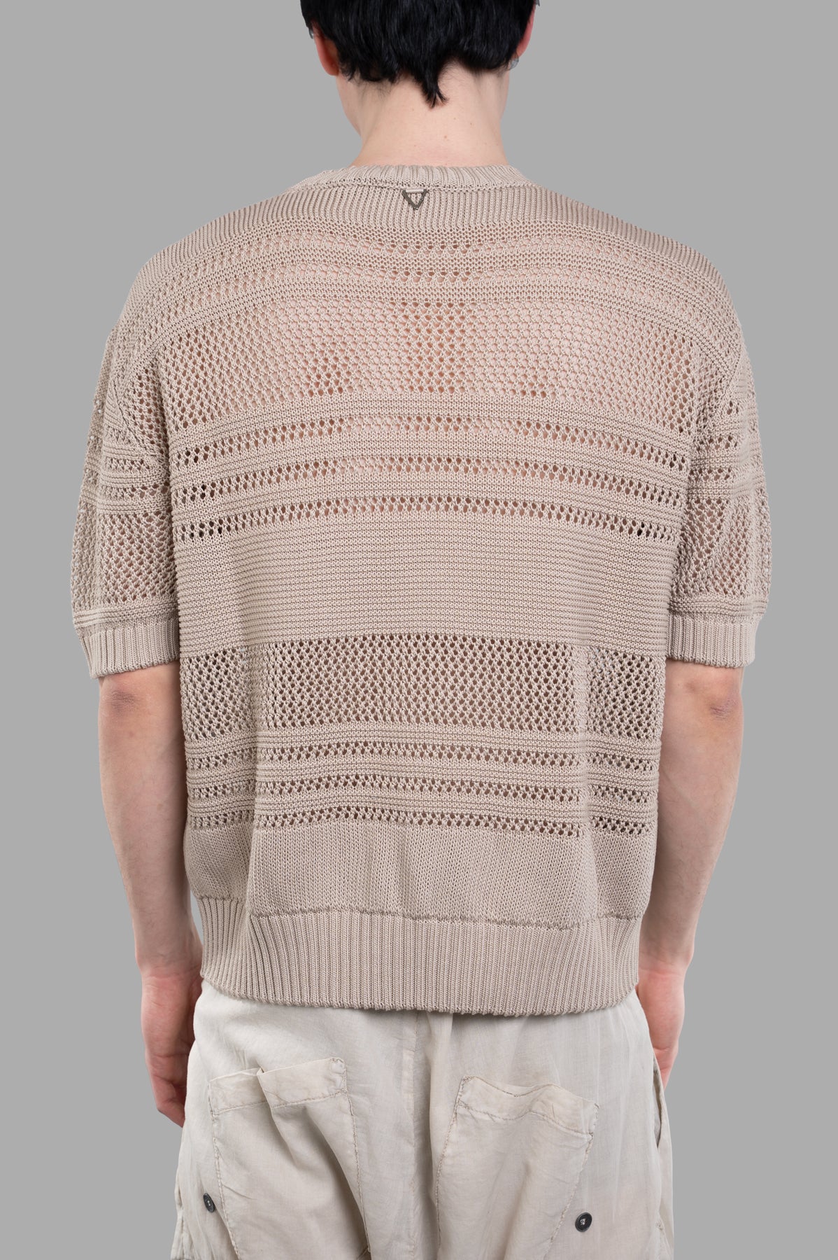 AION Perforated-mesh T-shirt displayed from the back, showcasing its breathable knit texture and beige color.