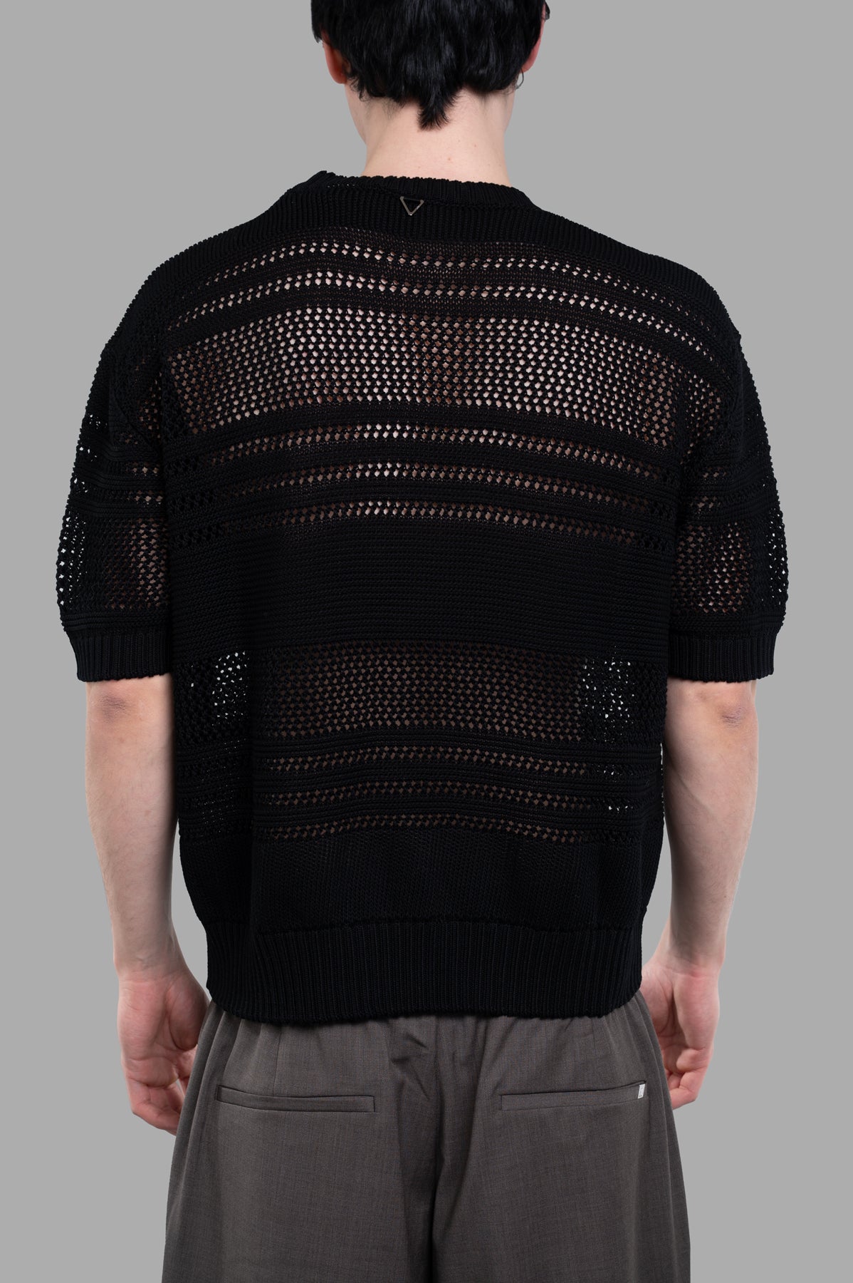 AION Perforated-mesh T-shirt in black, featuring a stylish crewneck and short sleeves, shown from the back on a model.
