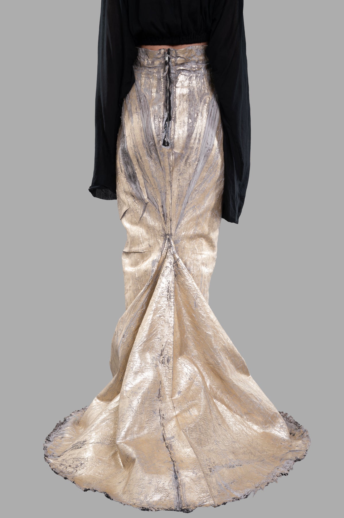 Rick Owens Lido Maxi Skirt in gold, featuring a flowy train and concealed rear zipper, shown from the back on model.