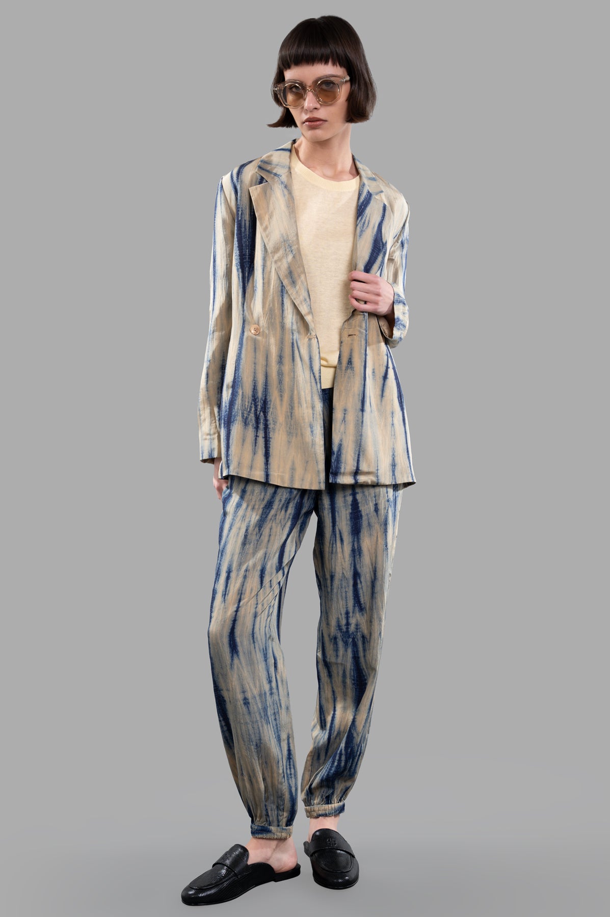 Joseph Tie-dye Silk Jacket on model, front view. Sand/navy pattern, double-breasted lightweight design in habotai silk.