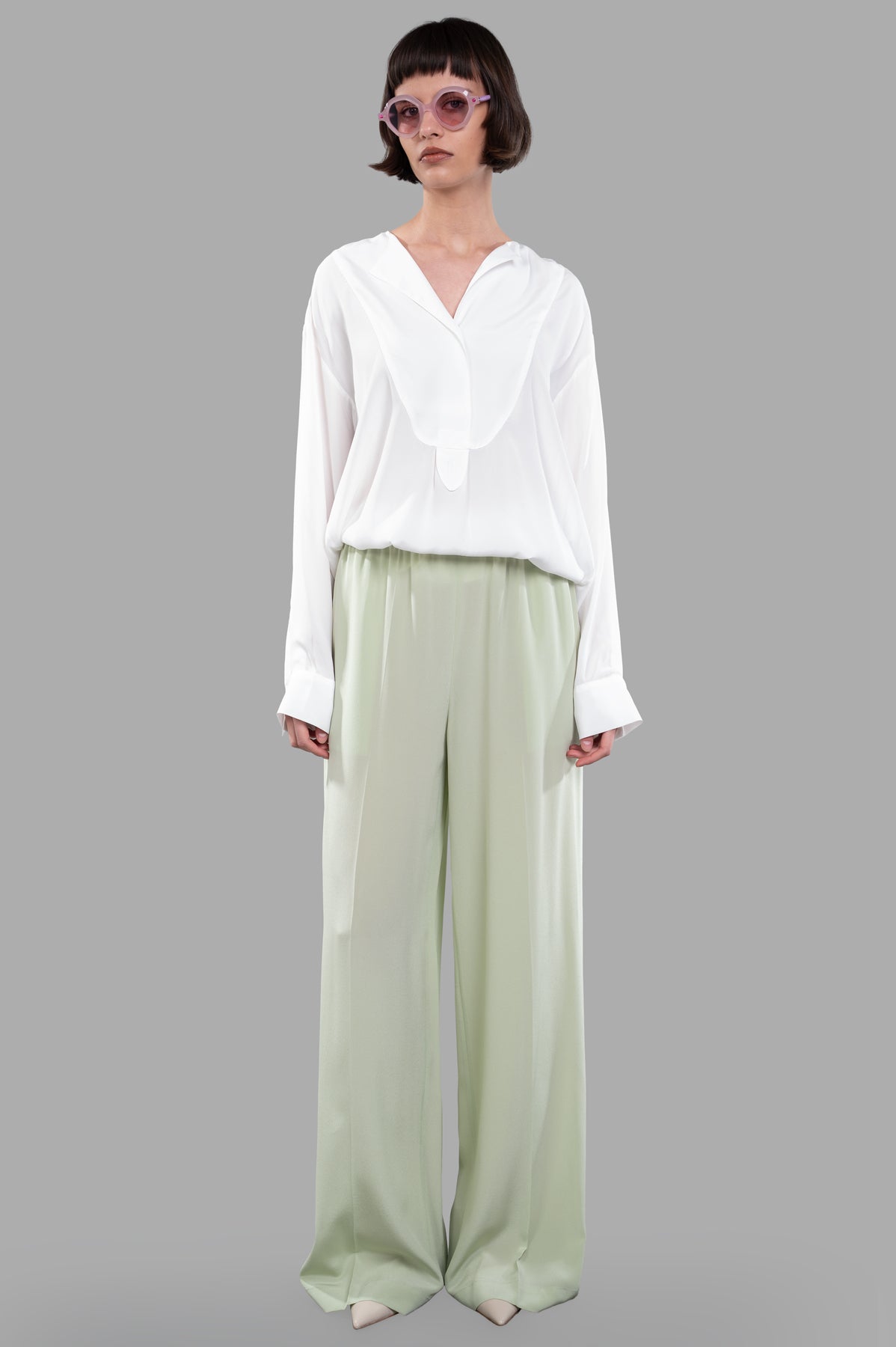 Joseph Crepe de Soie Silk Trousers in Matcha worn by model, showcasing wide-leg design and relaxed fit.