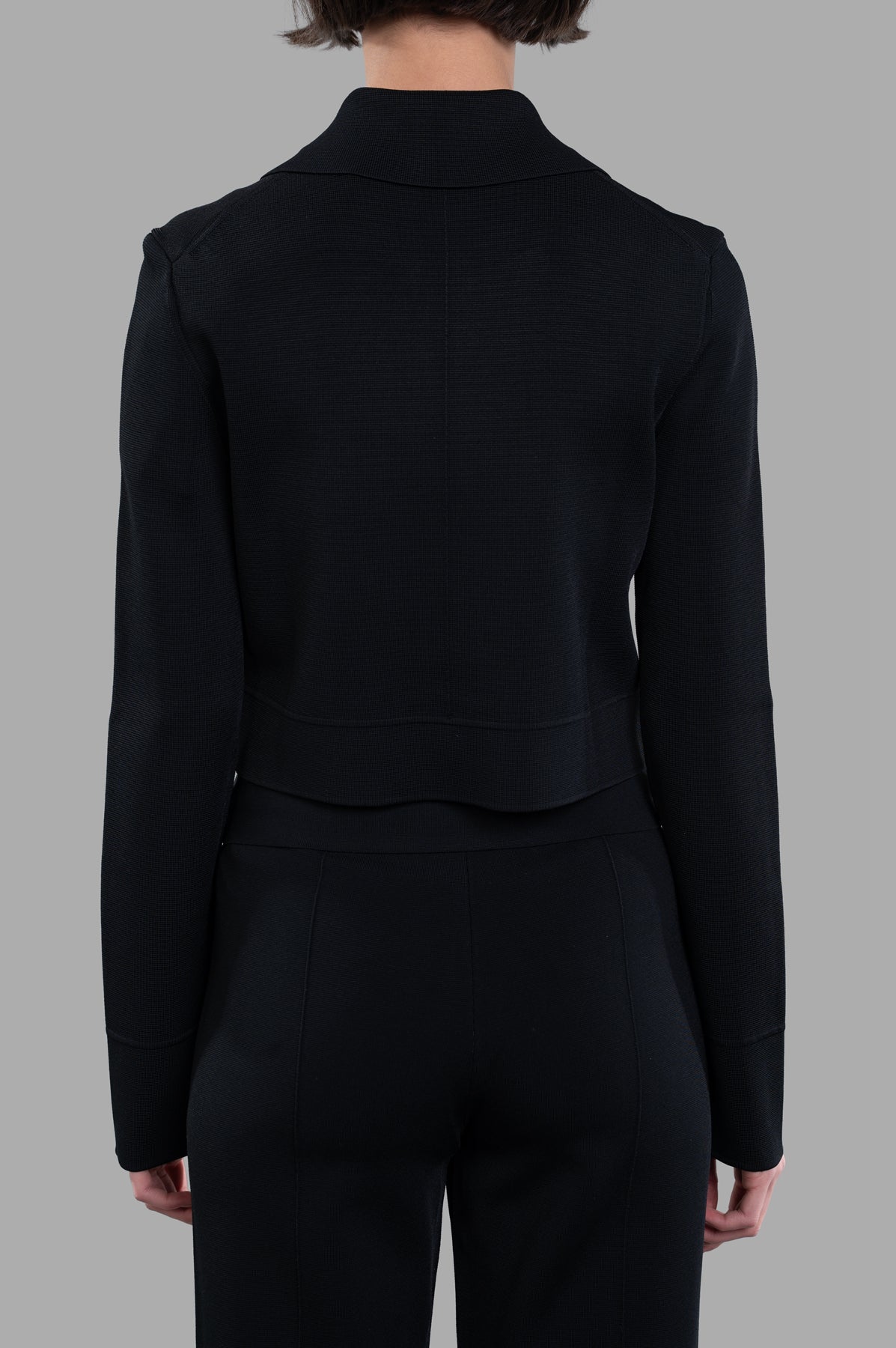 Joseph Stretch-zip Jacket, back view of boxy-cut Milano knit in black, showcasing sleek fabric and collar detail.
