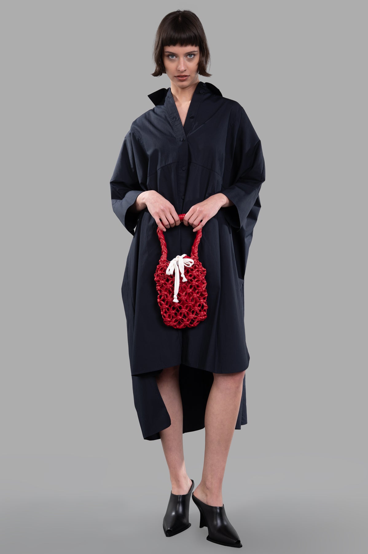 Joseph Dania Poplin Cotton Dress in black, shown on-model with relaxed fit, wide sleeves, and step hemline.