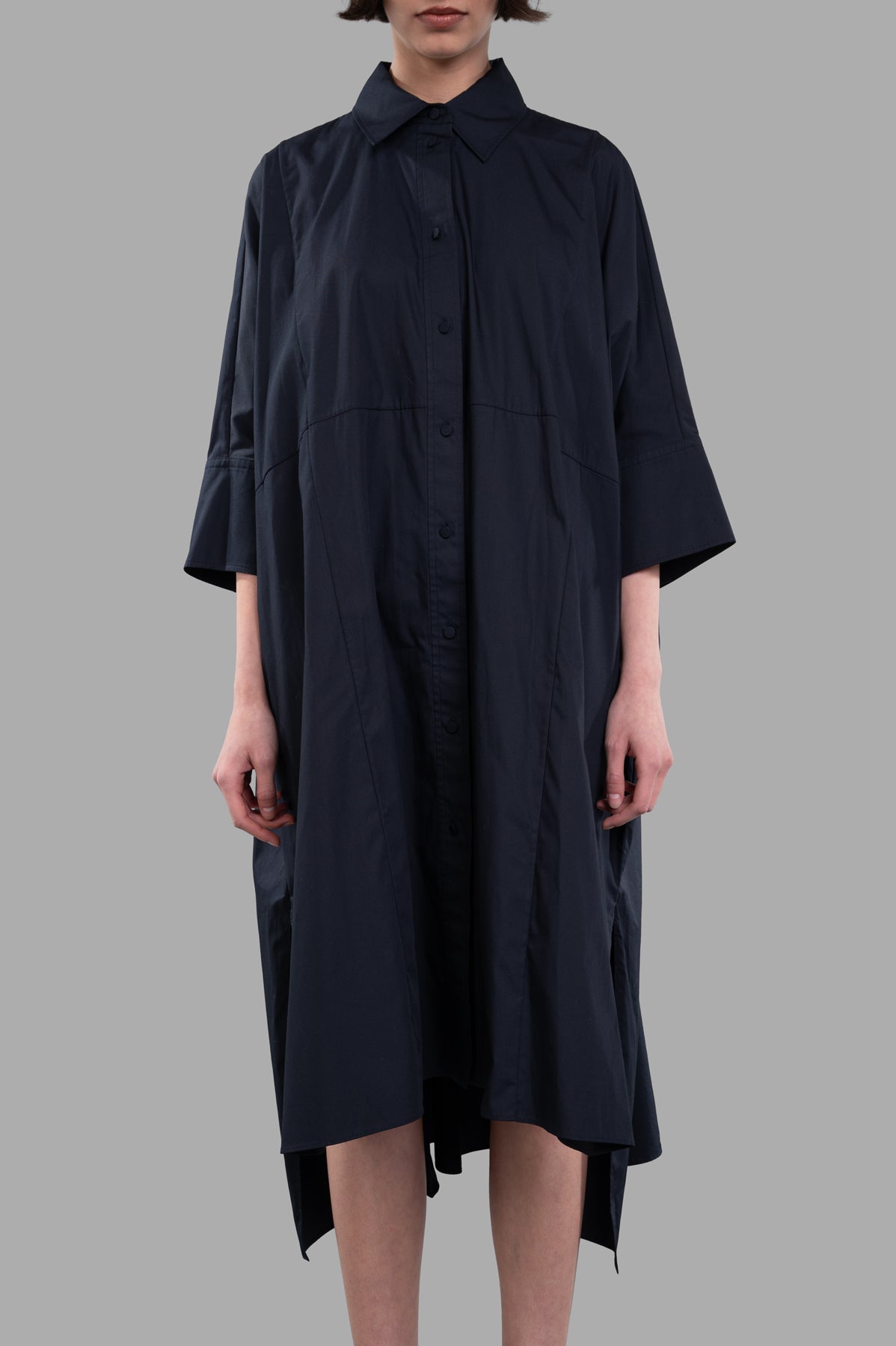 Joseph. Oversized Dania Poplin Cotton Dress in black, featuring wide sleeves and step hemline, shown on-model.
