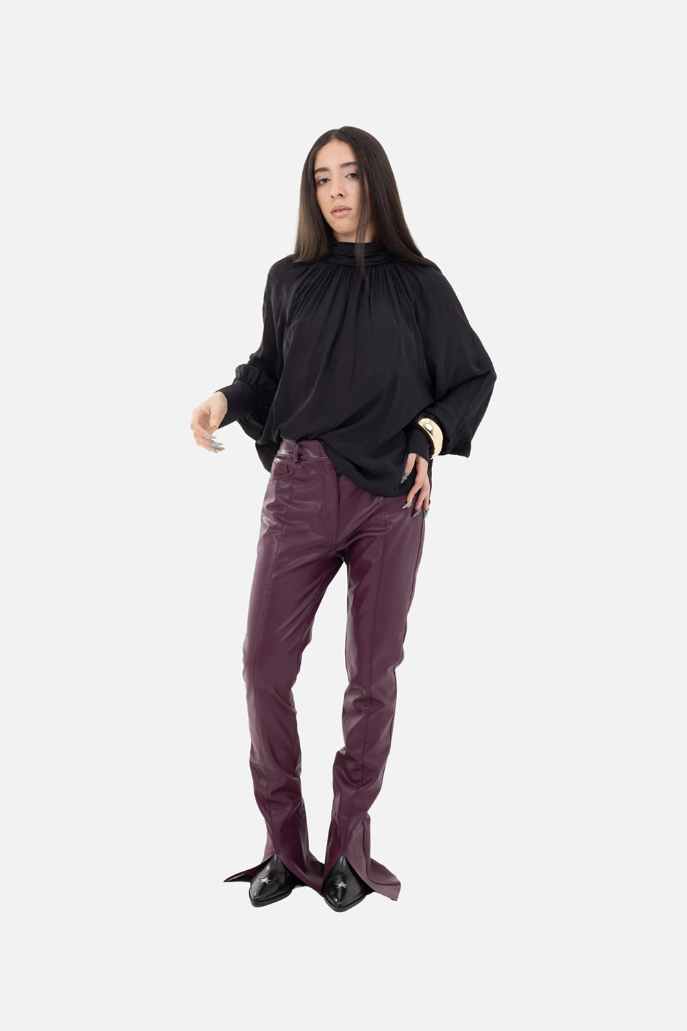 Norma Kamali women's spat jeans in plum, on-model full-length, slim leg with dramatic split cuffs over boots