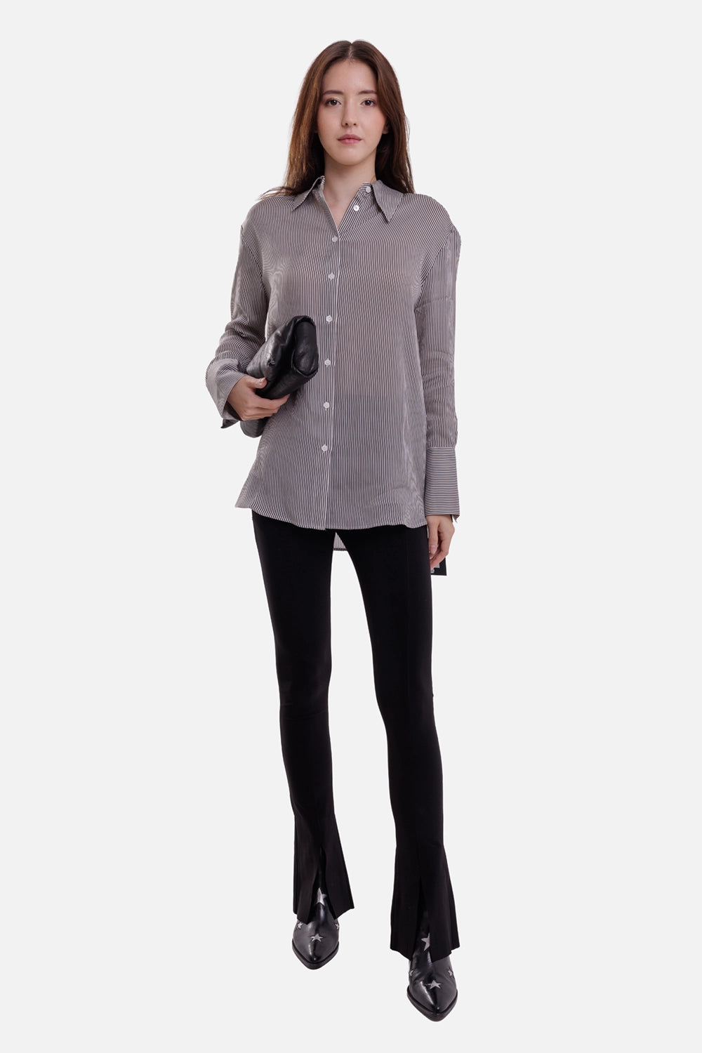 Norma Kamali women's black Spat leggings, on-model full-length view with slim legs and split hems