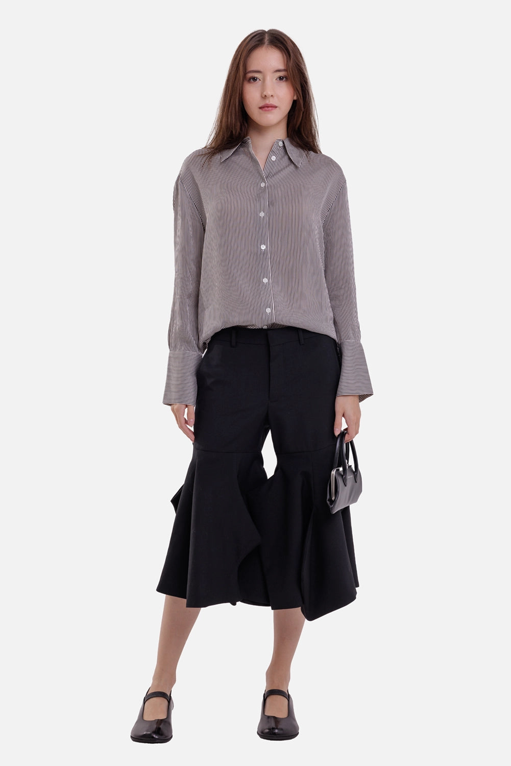 Anine Bing women's striped shirt in white and black, full-length model view with relaxed drape and button front