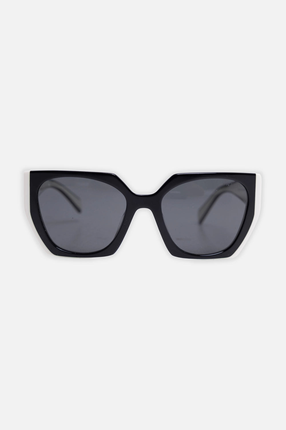 Pre-owned Prada women's sunglasses in black and talc, front view, squared cat-eye frame with white corner accents
