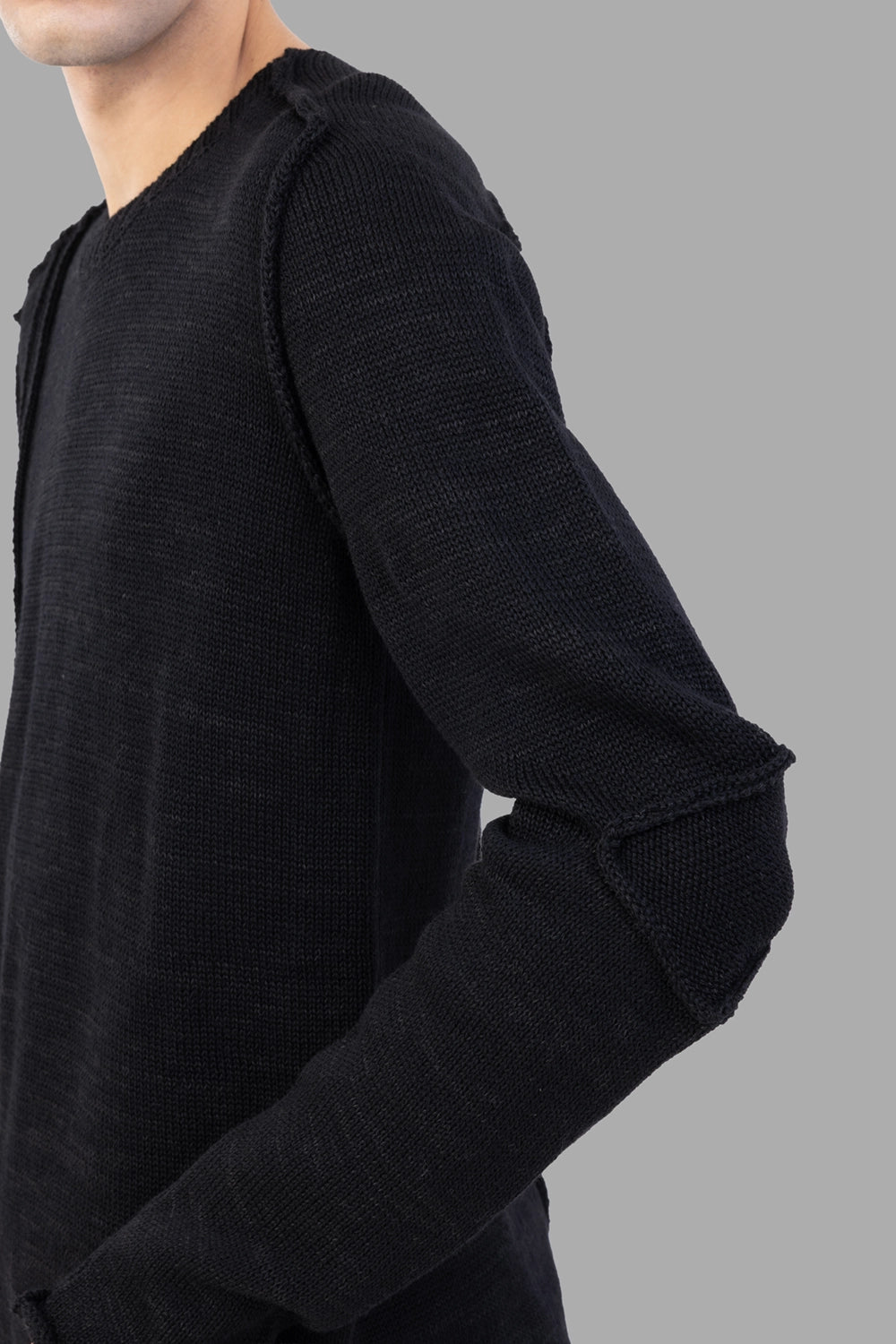Masnada black sweater, 3/4 view, articulated elbow insert detail