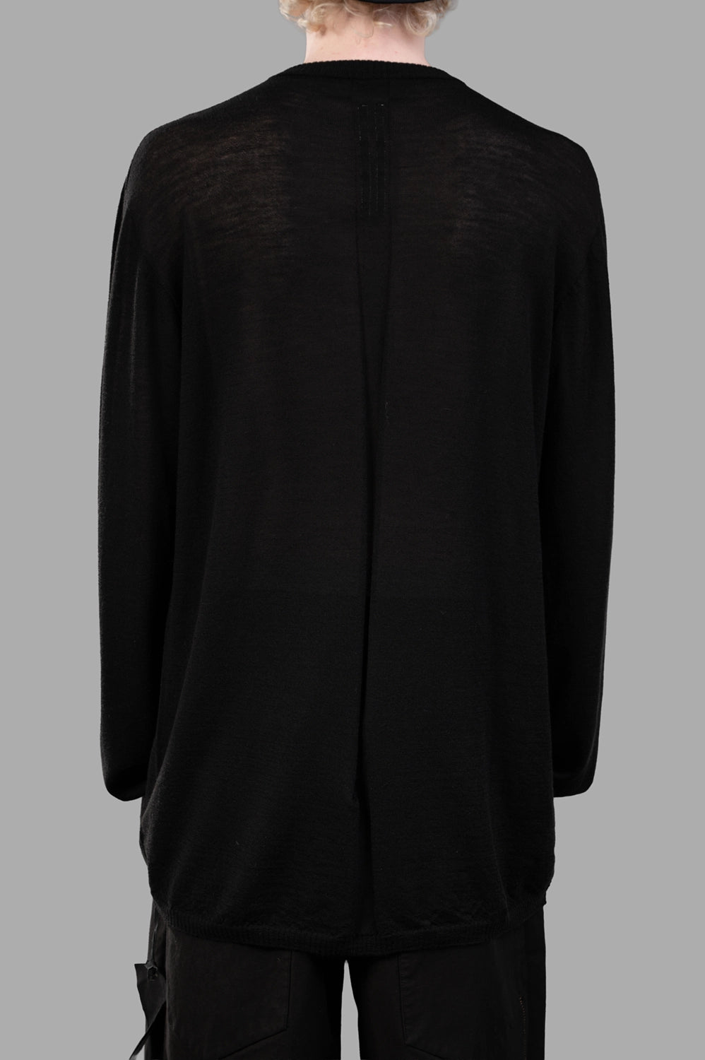 Rick Owens sweater in black, back view, signature center back seam and ribbed hem