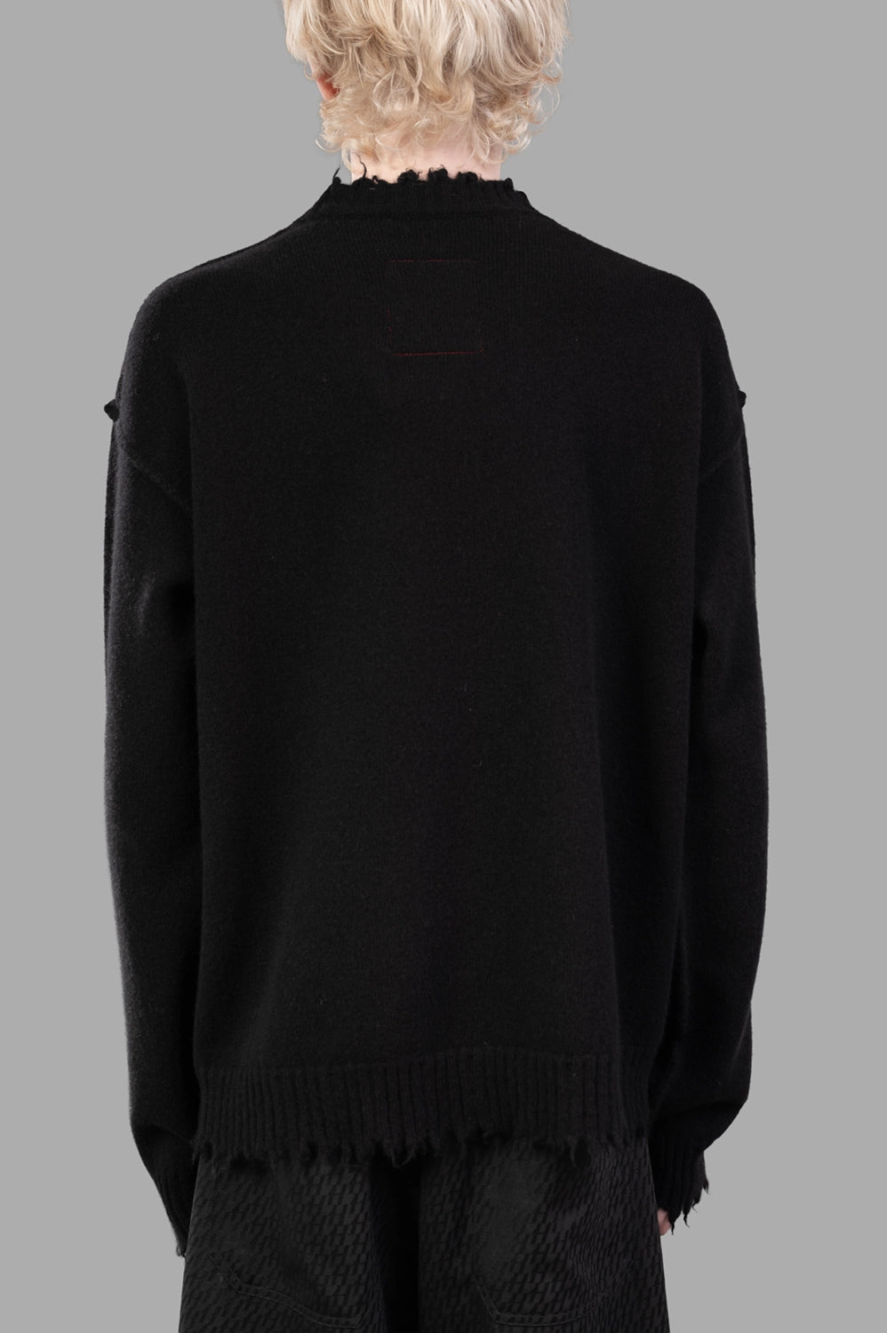 UMA WANG sweater in black, back view, clean back with distressed hem detail