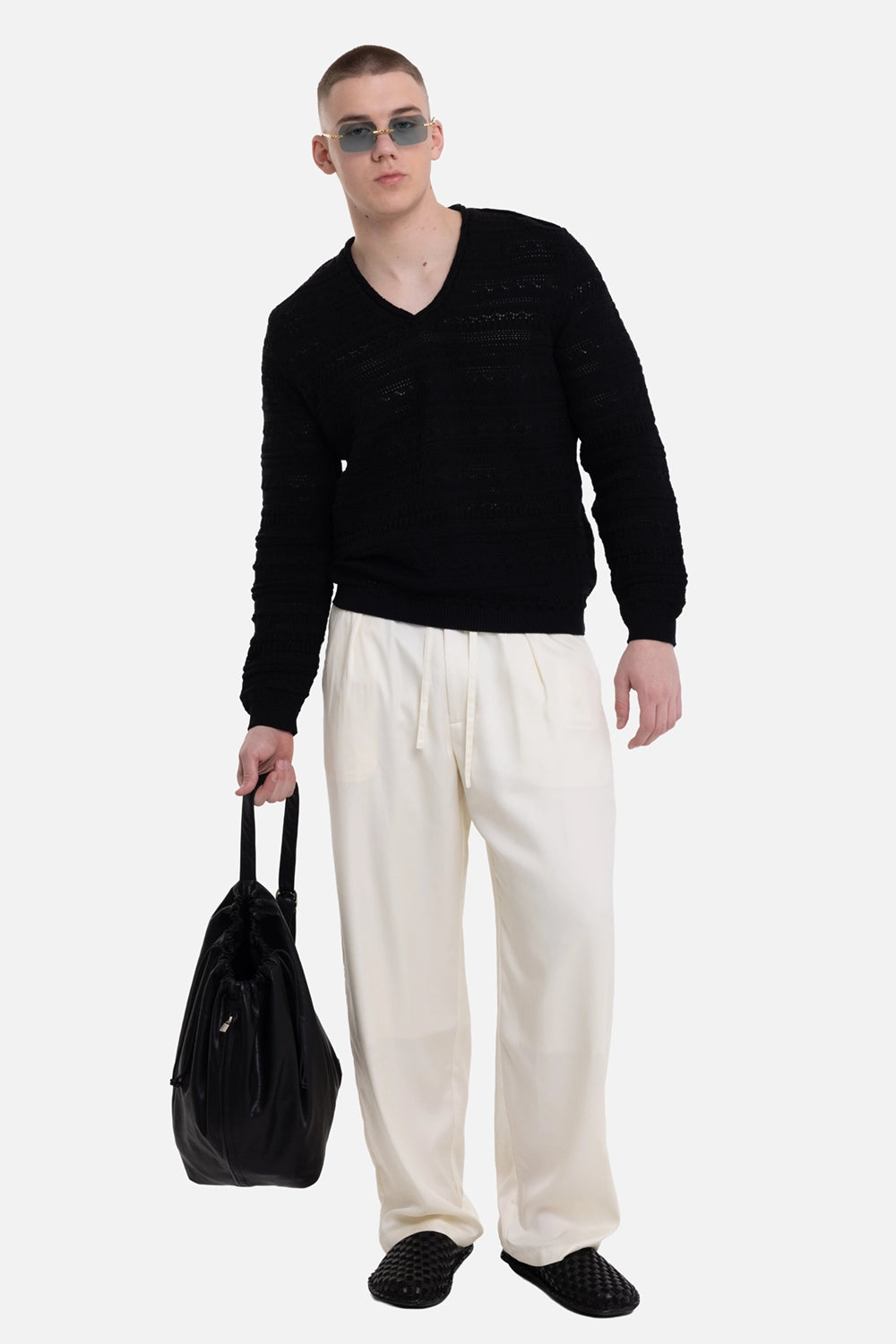 Marc Point men's sweater in black, on-model full-length view, relaxed fit and semi-sheer knit