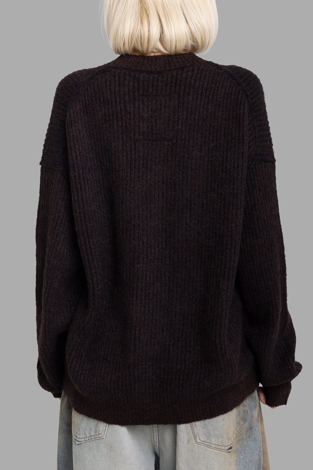 Uma Wang women's brown and black striped wool sweater, back view showing rib knit texture and relaxed drape