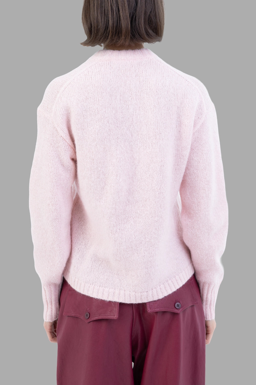 By Malene Birger women sweater in Chalk Pink, back view, raglan seams and clean rib knit.