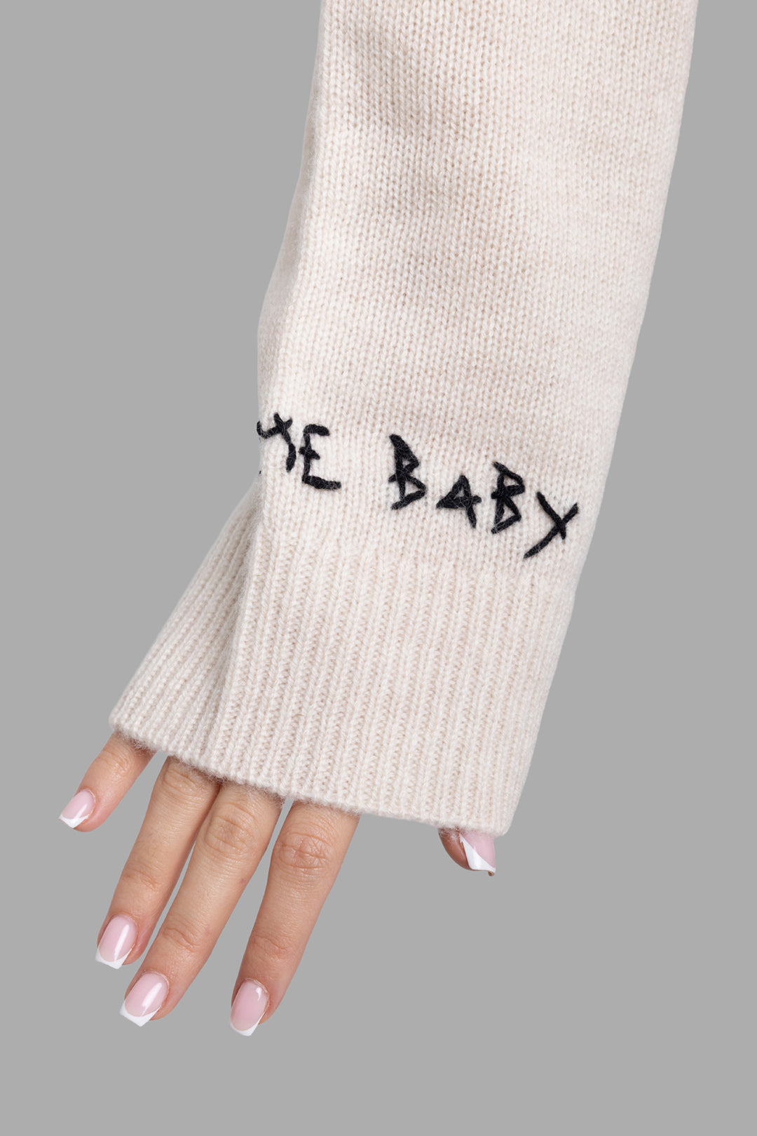 Zadig & Voltaire women's ecru cashmere sweater, cuff detail with Bye Baby embroidery and ribbed knit.