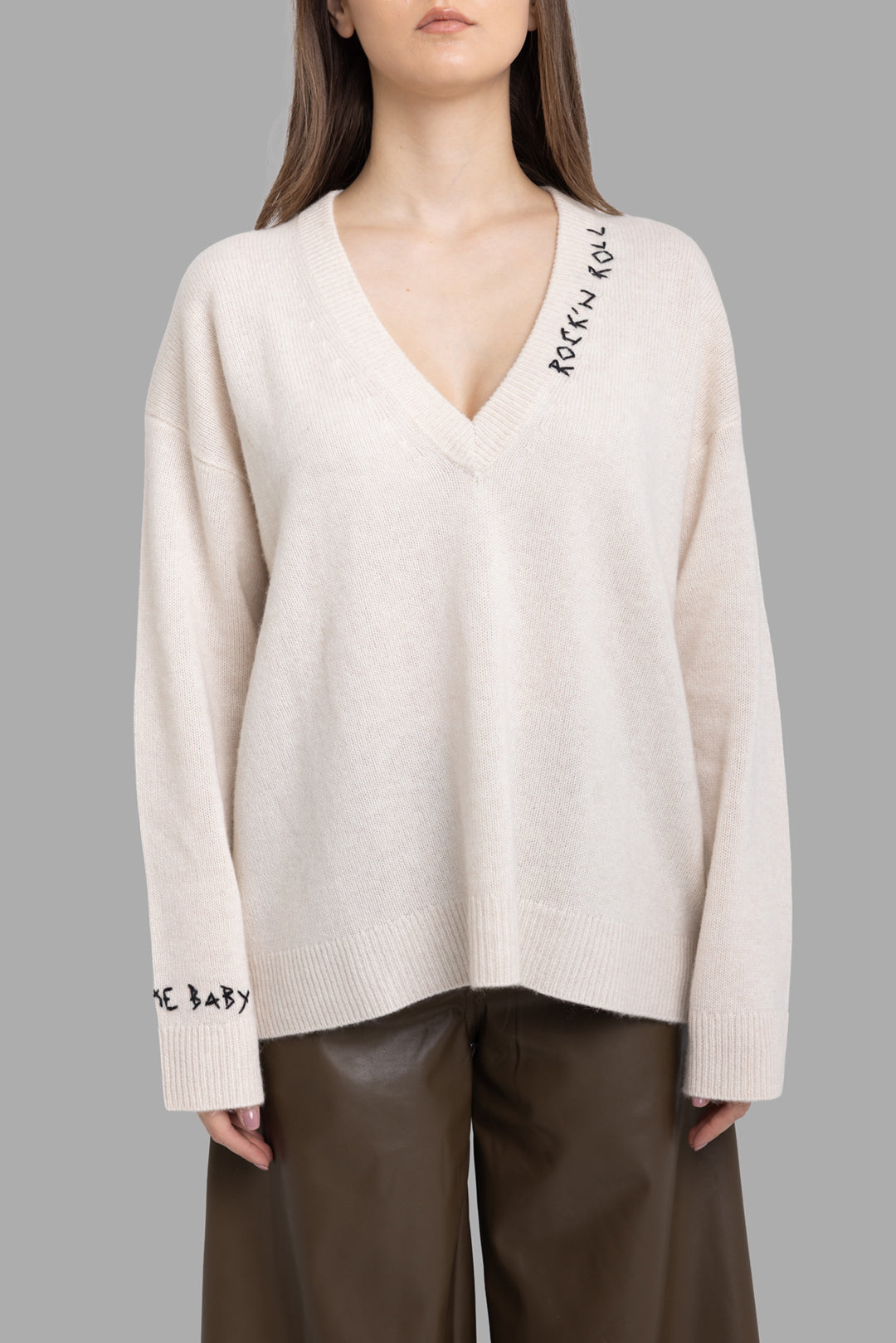 Zadig & Voltaire women's ecru cashmere sweater, front view with deep V-neck and Rock n Roll embroidery.