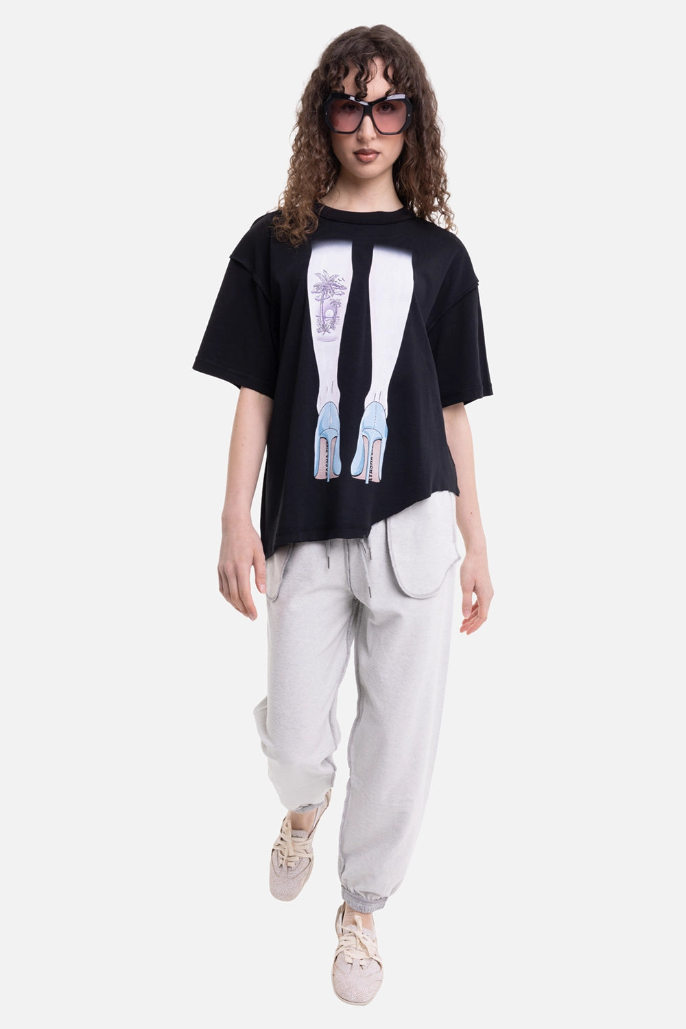 Natasha Zinko unisex T-shirt in black, on-model full-length view, dropped shoulders and uneven hem