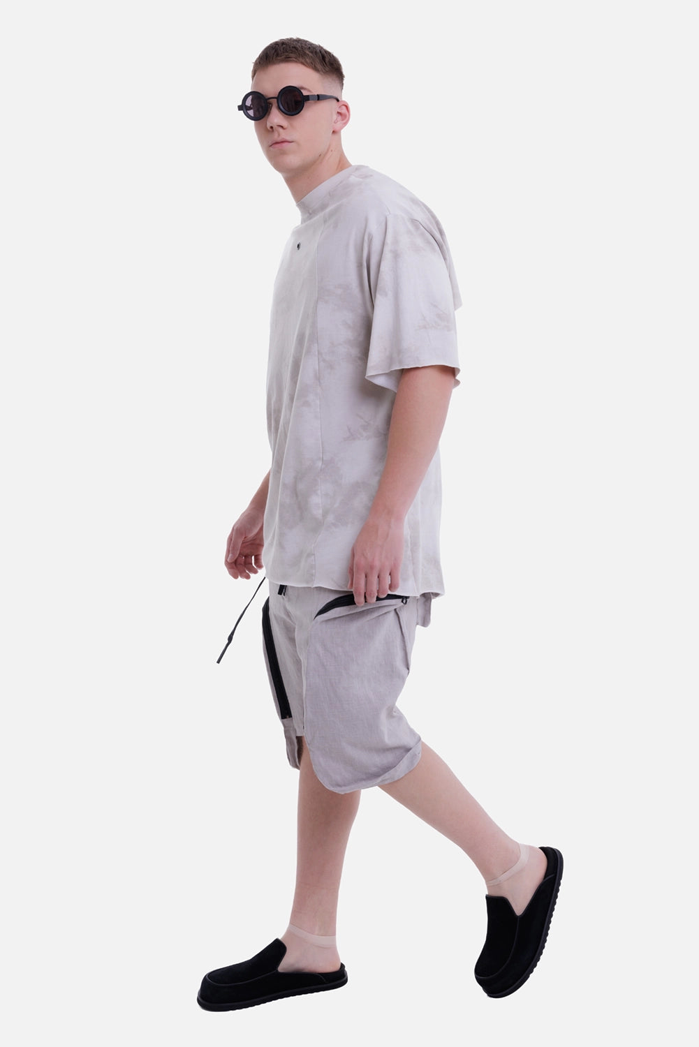 Justin Gall men's blotch beige cotton T-shirt, side model view with oversized short sleeves