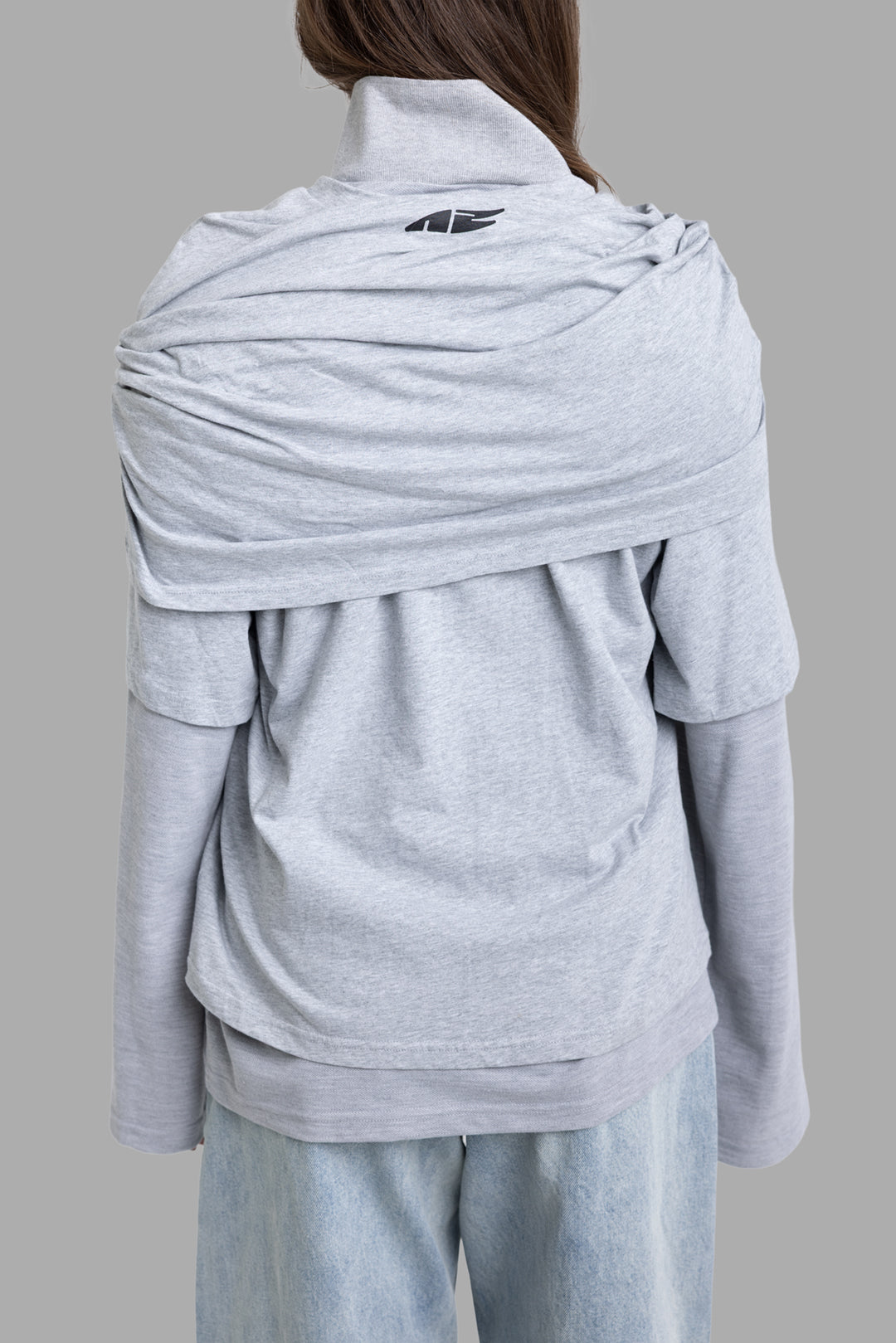 Natasha Zinko women's grey multi layer long sleeve T-shirt, back view, wrapped shoulder layer and black logo at upper back