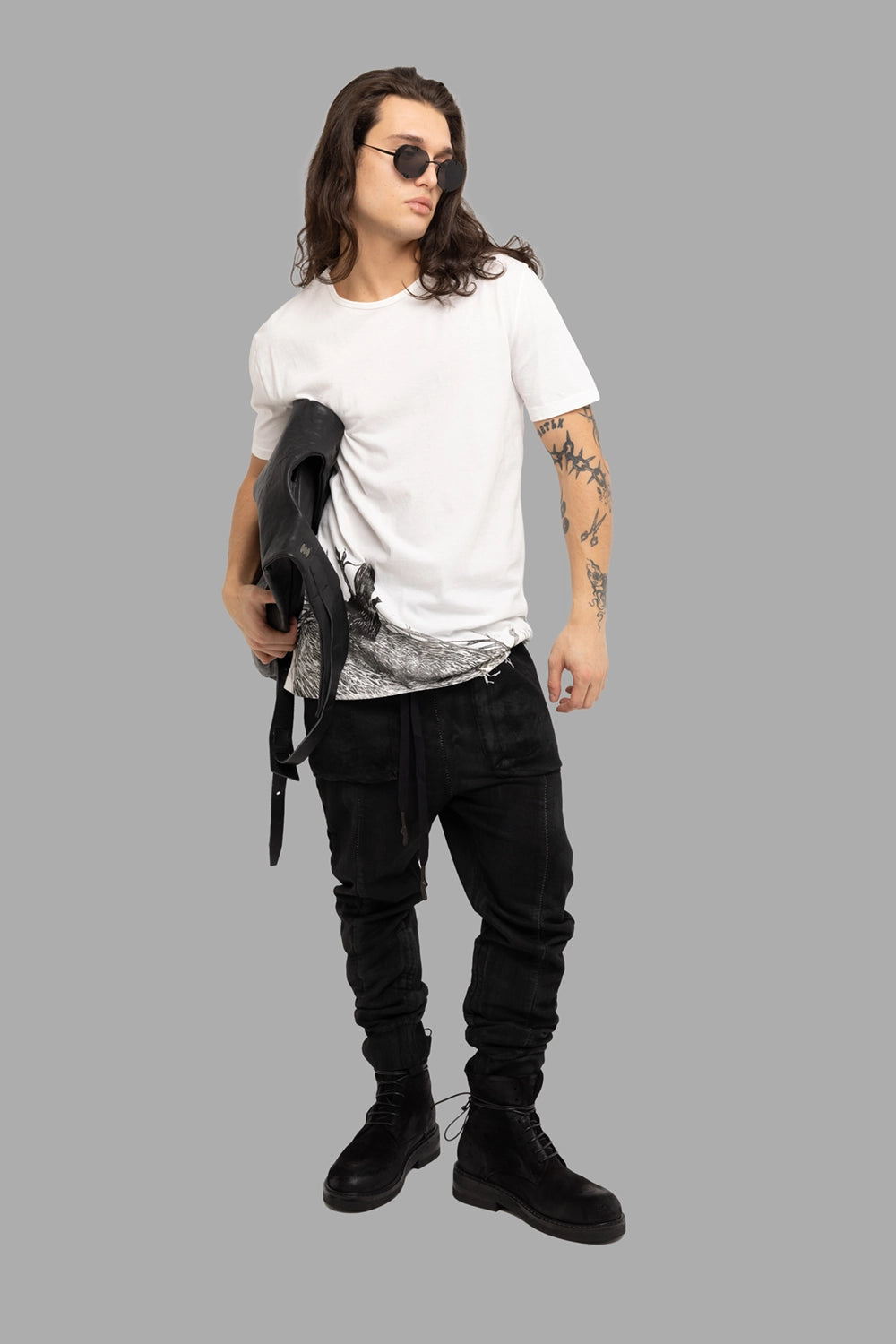 MD75 men’s t-shirt in white, on-model full length, crewneck with wraparound black hem graphic