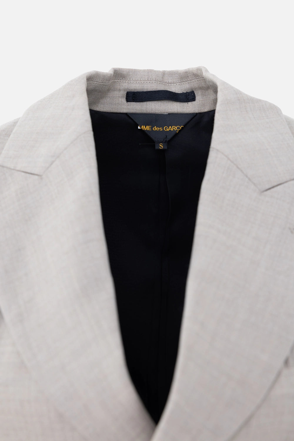Pre-owned Comme des Garçons women's tailcoat blazer in light grey, label view, black lining with brand neck tag