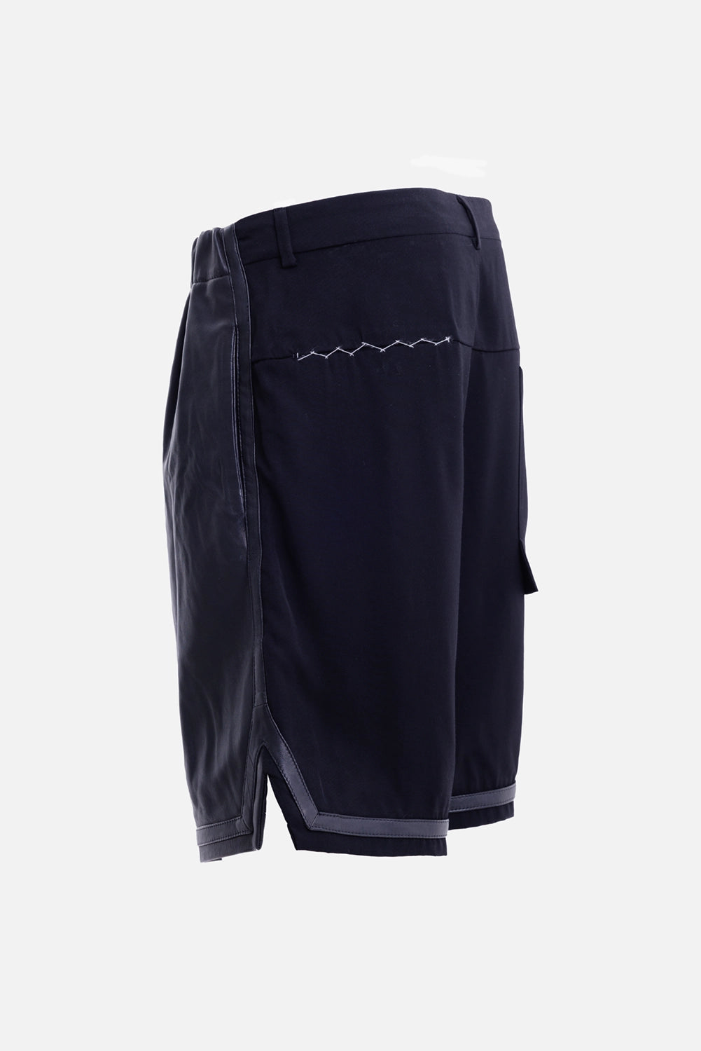 Justin Gall men's black tailored shorts, side view with bound edging and short hem slit