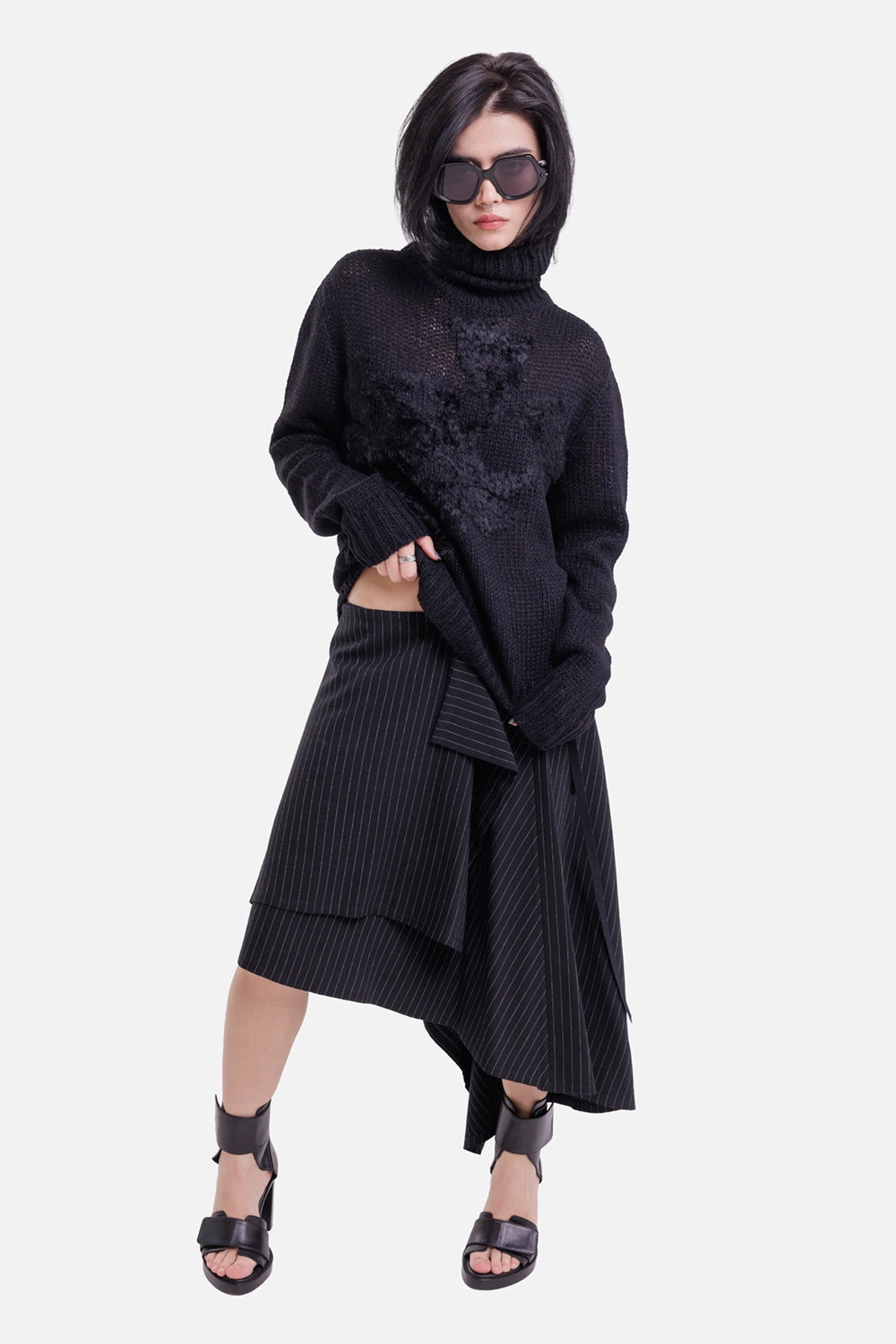 Ann Demeulemeester women's black turtleneck sweater, full-length model view with raised floral knit