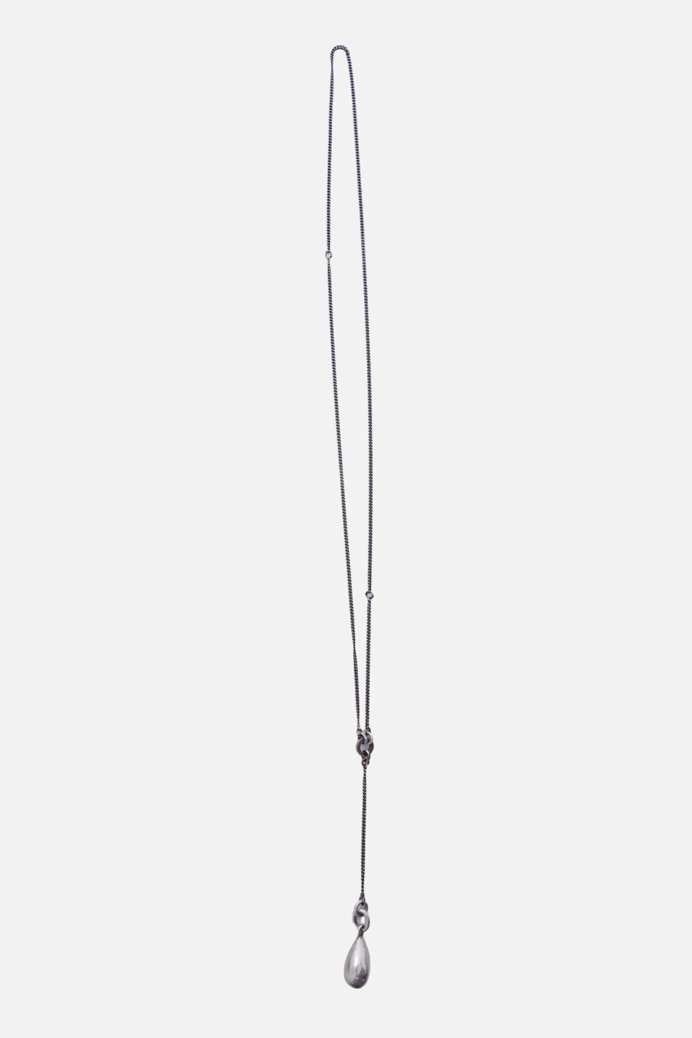 Ann Demeulemeester Tinne necklace in antique silver, full view with fine chain and teardrop pendant
