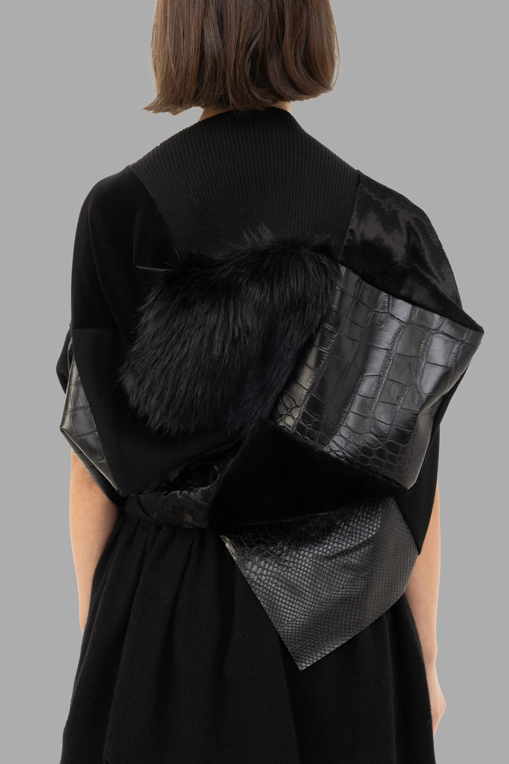Junya Watanabe women patchwork top in black, back view, croc-embossed panel and plush faux-fur patch.