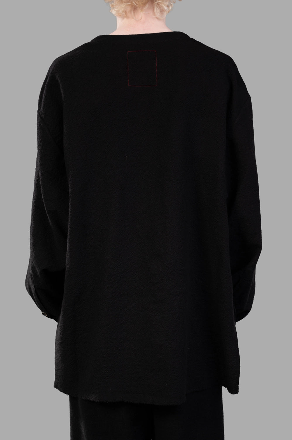 UMA WANG top in black, back view with red box stitch at neck and clean straight hem