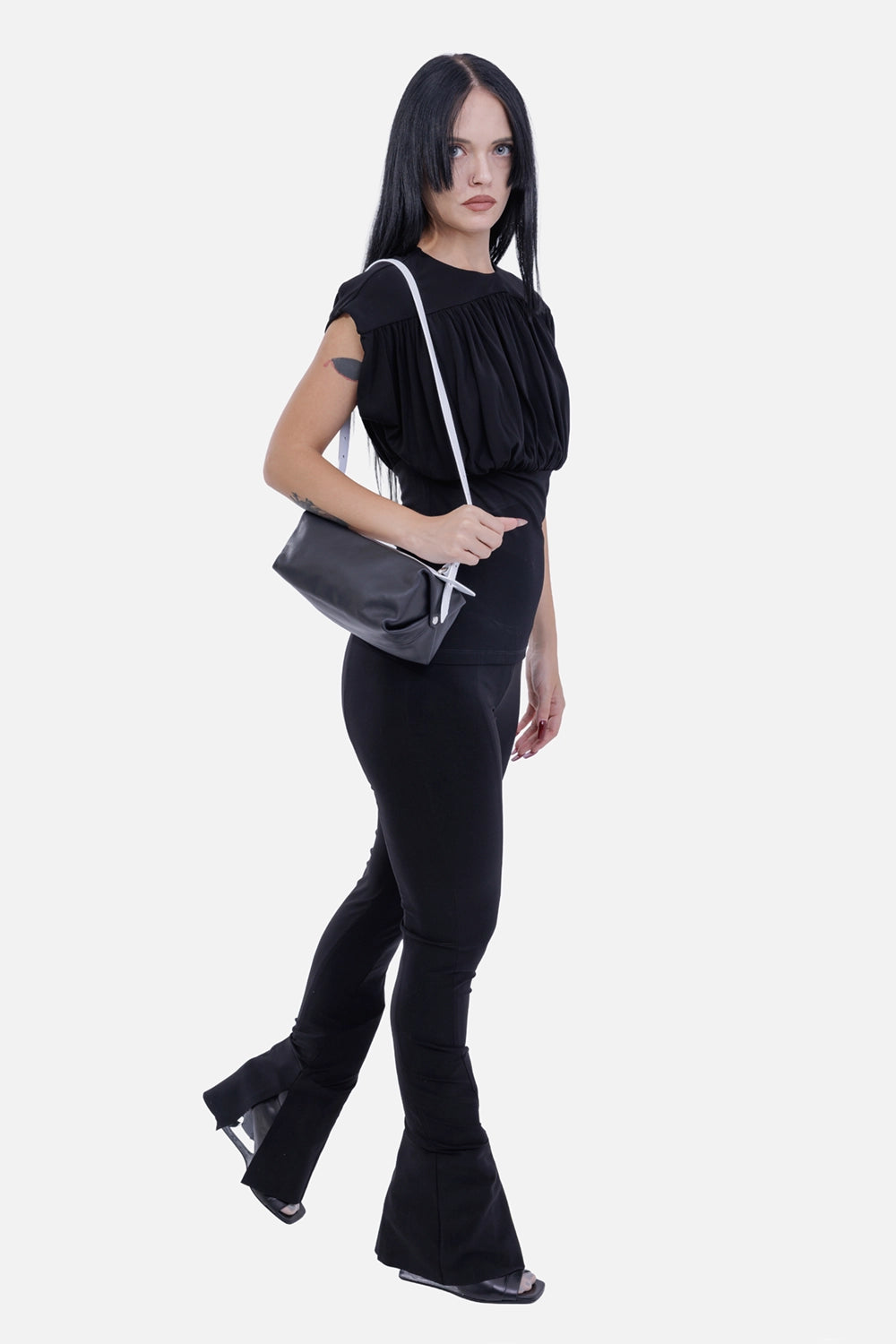 Anine Bing women's black Fran top, on-model view with gathered bodice, defined waist and cap-style shoulders