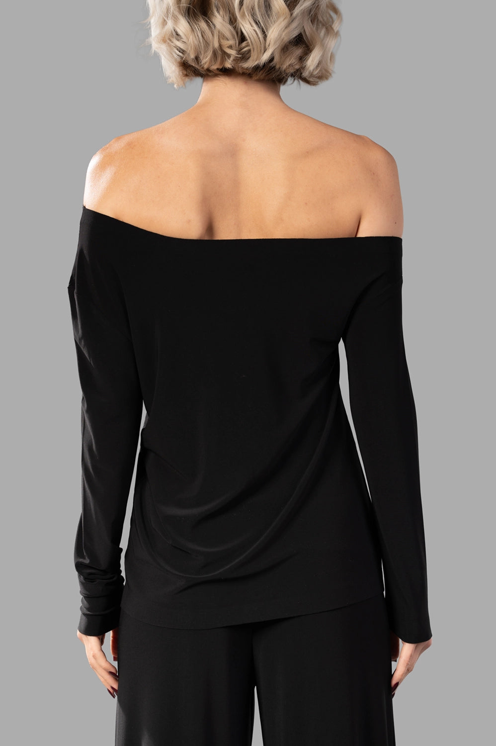 Norma Kamali top in black, back view, smooth stretch fabric and straight hem