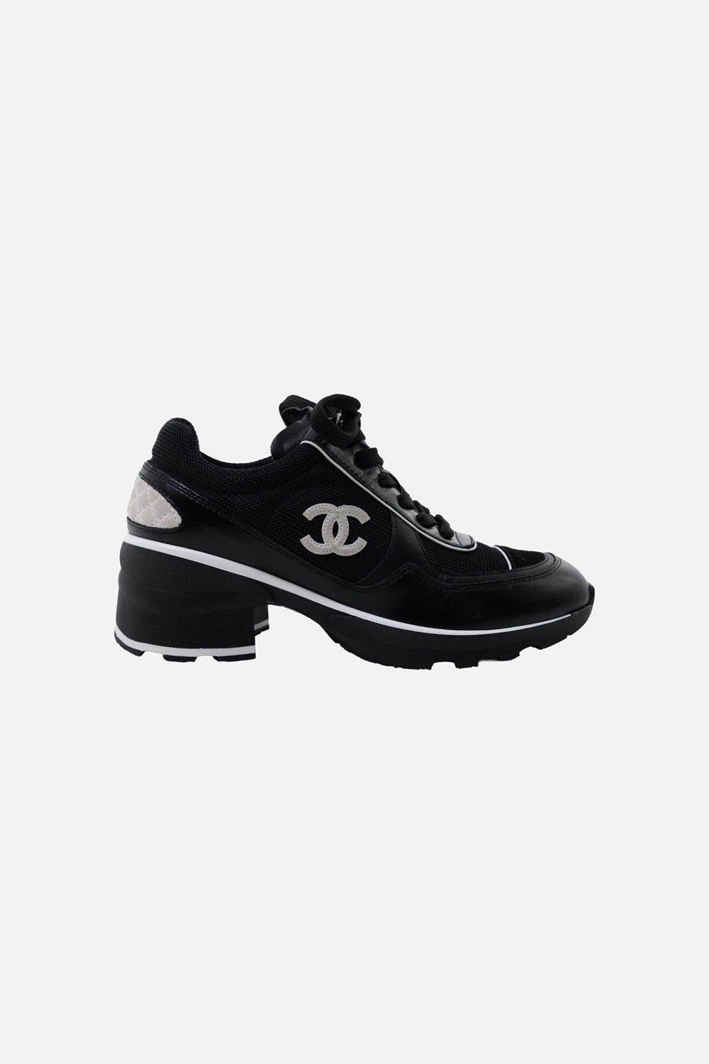 Pre-owned Chanel women's trainers in black, side view, CC logo patch and contrast piping