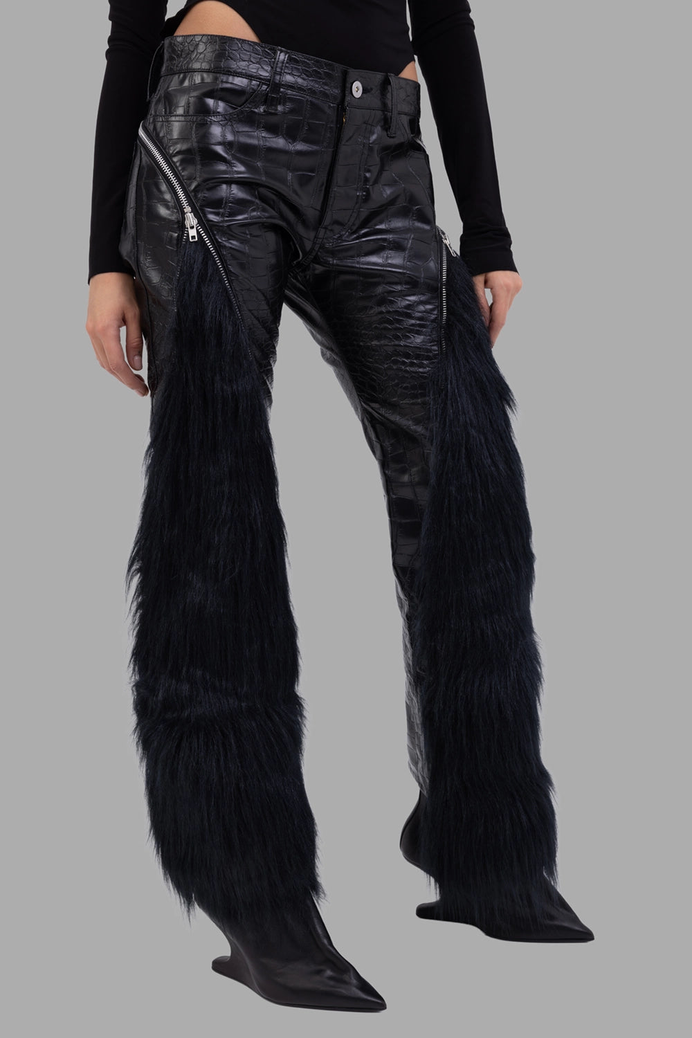 Junya Watanabe women trousers in black, 3/4 view, long faux-fur panels and croc-embossed finish.
