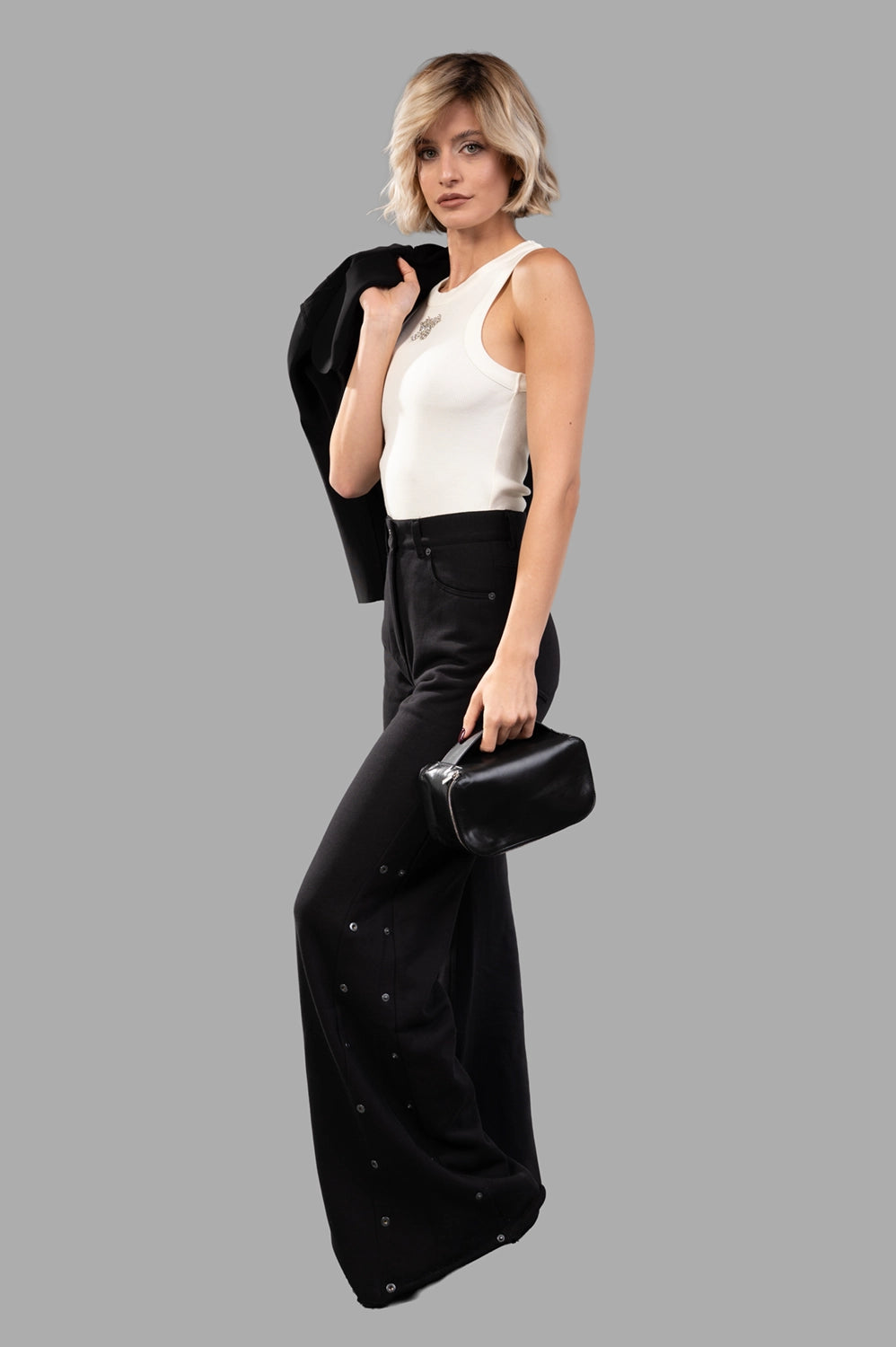 Sehnsucht Atelier wide-leg trousers in black, on-model full length with side snap plackets and pooled hem