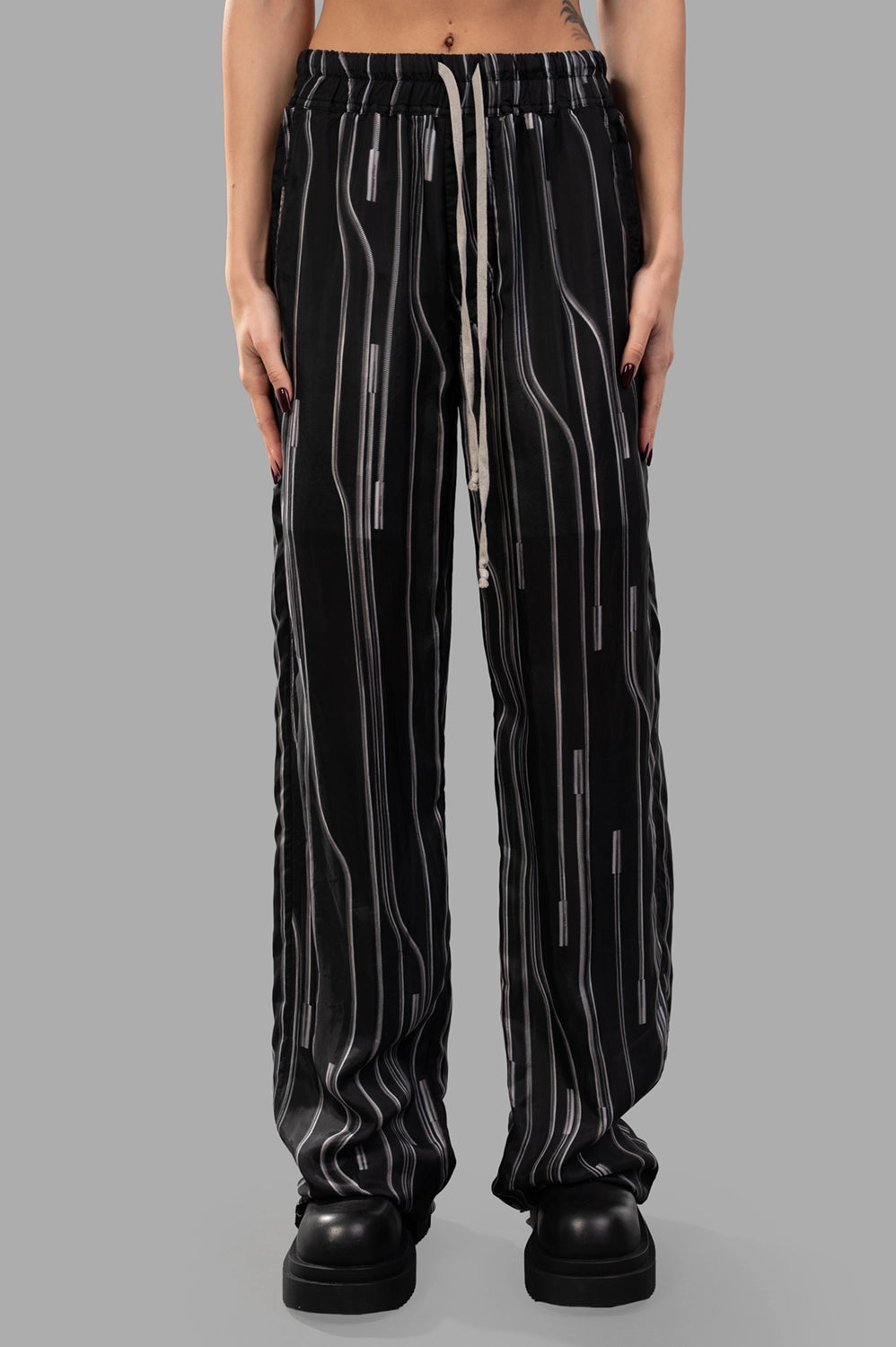 Rick Owens trousers in Black/Pearl, fabric close-up from back highlighting black/pearl vertical stripes.