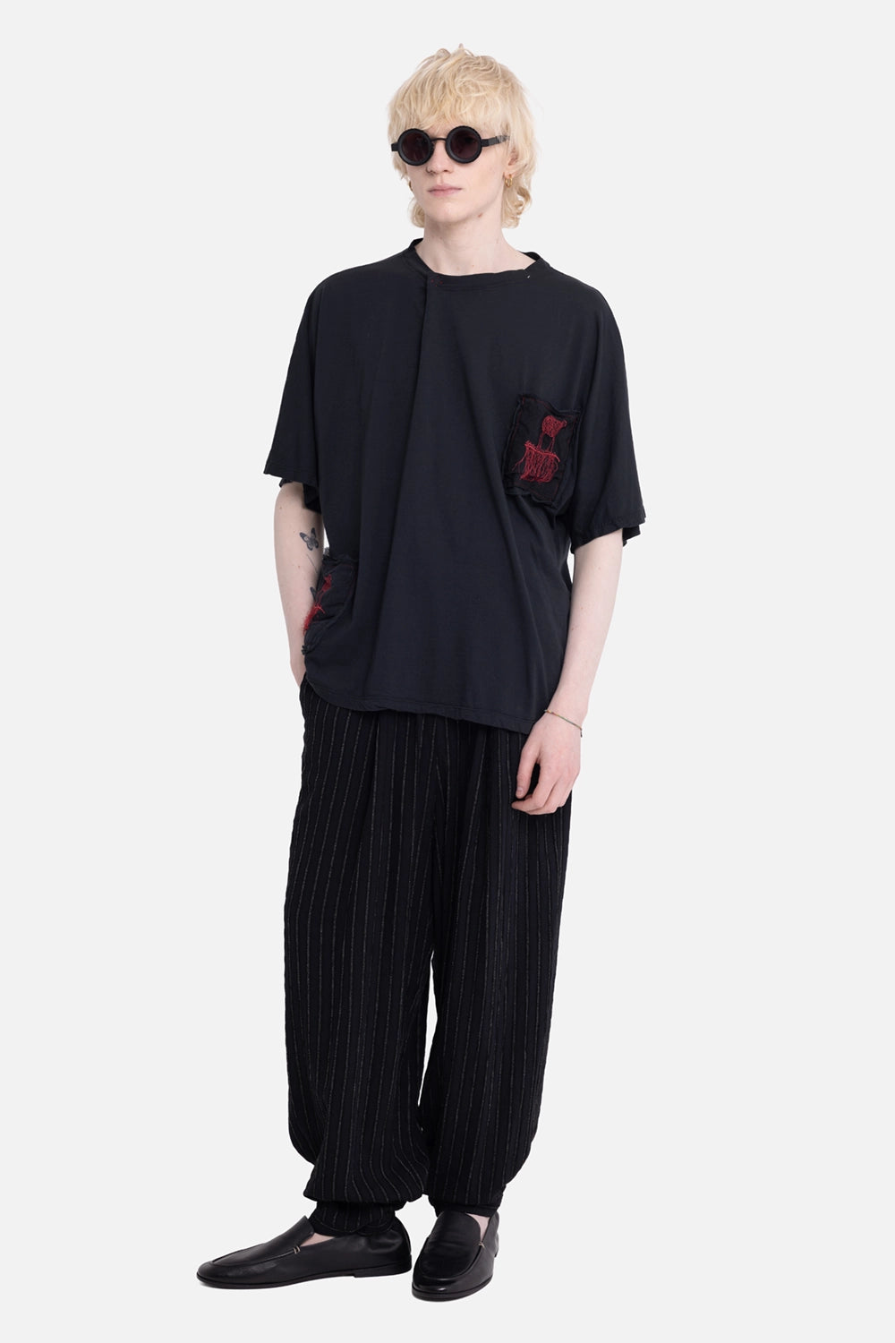 La Haine Inside Us unisex trousers in black stripe, on-model full-length with wide leg and textured pinstripes
