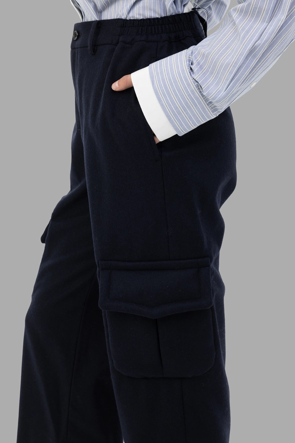 Comme des Garçons women cargo trousers in navy, cargo-pocket detail with padded flap and soft wool twill.